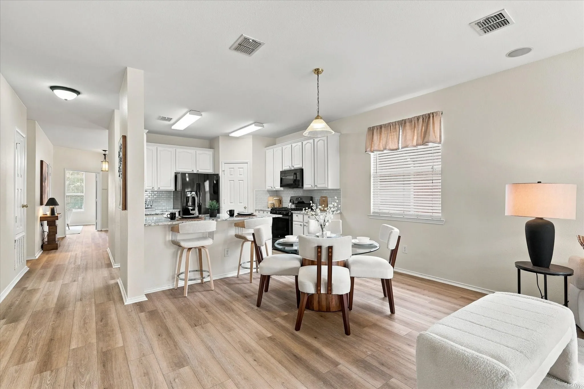 An open floorplan and thoughtful updates make this home easy to live in and enjoy. LVP flooring runs throughout all living areas, while the kitchen was remodeled in 2022.