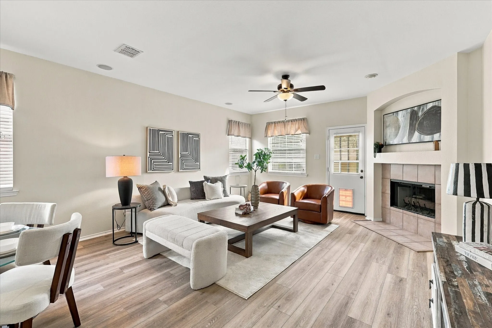 The spacious family room is open to the kitchen and breakfast area, creating an easy flow for everyday living and entertaining. LVP floors, a gas fireplace and plenty of natural light make this a comfortable space to gather and relax.