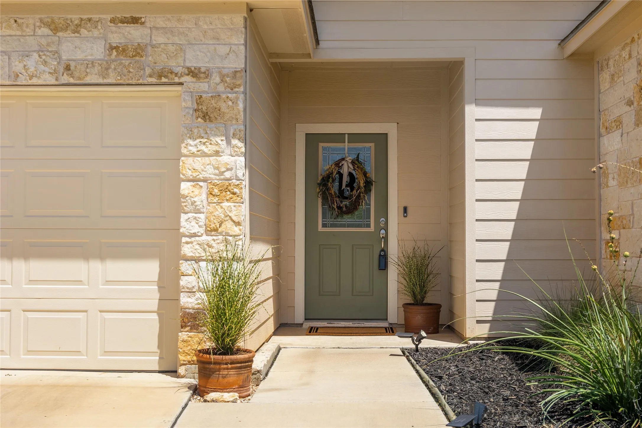 Entrance to property featuring a garage