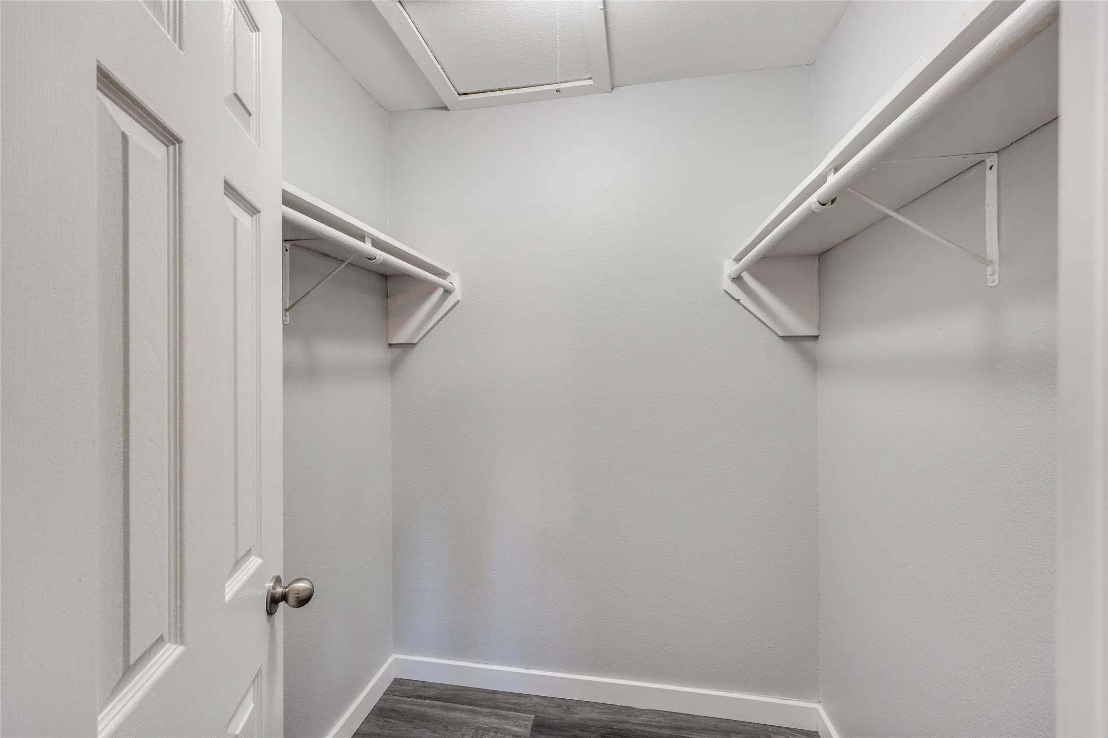 Walk-in closet with dual shelving and clothing rods