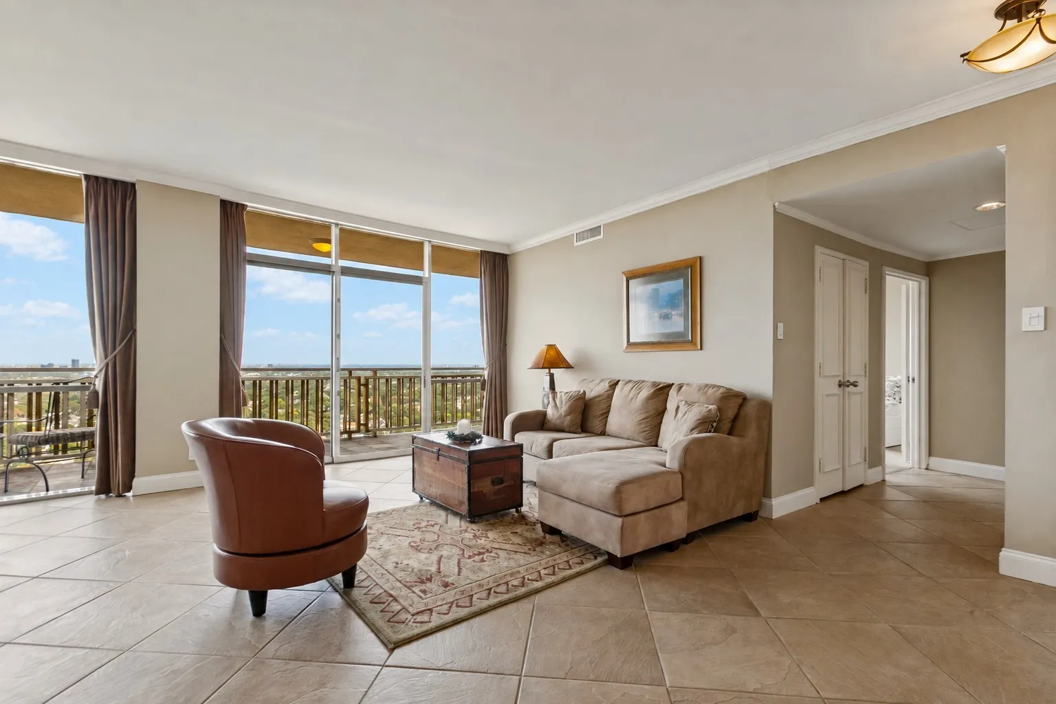 Living areas have wall to wall windows and 18 x 18 tile floors