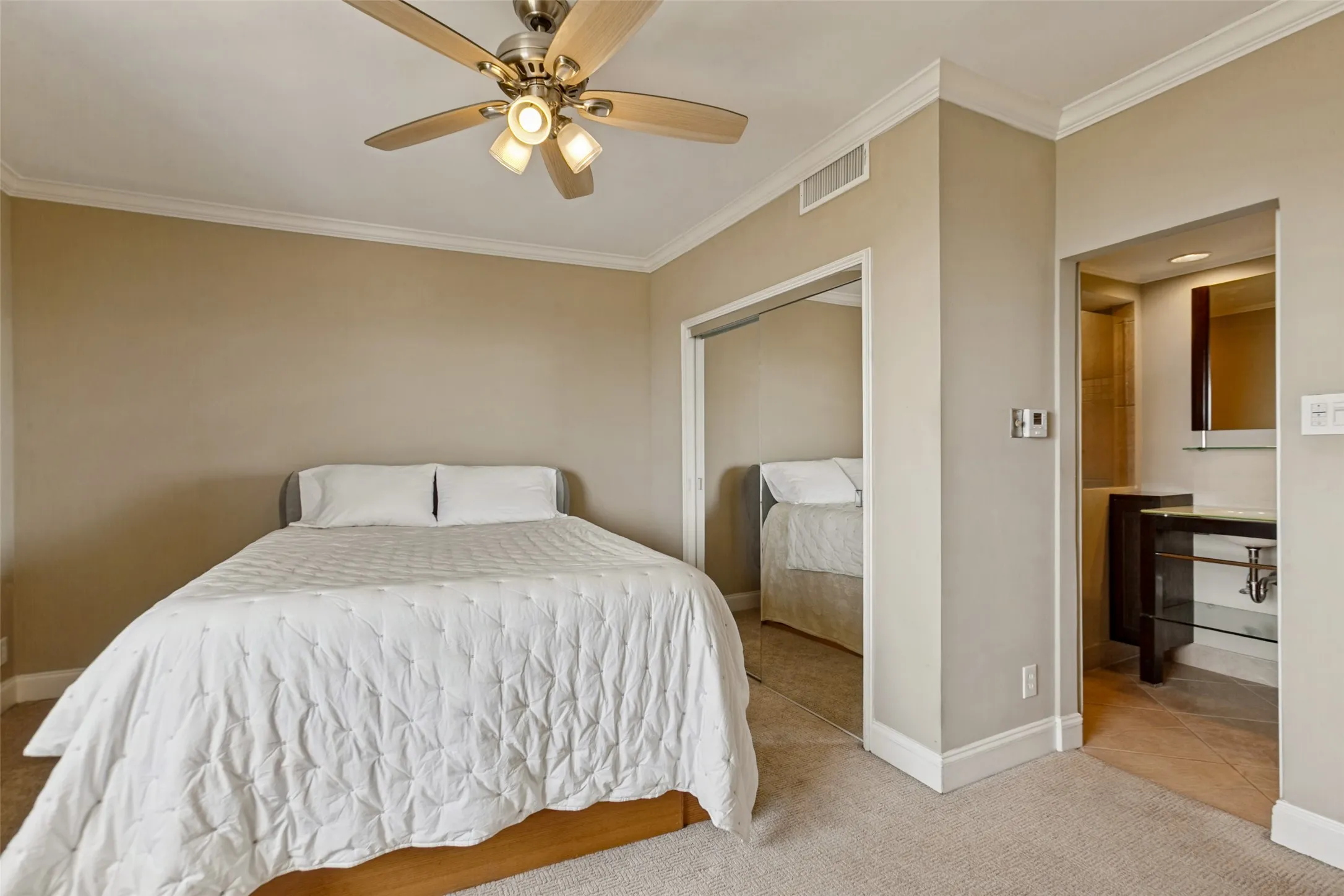 Primary bedroom showing one of three closets