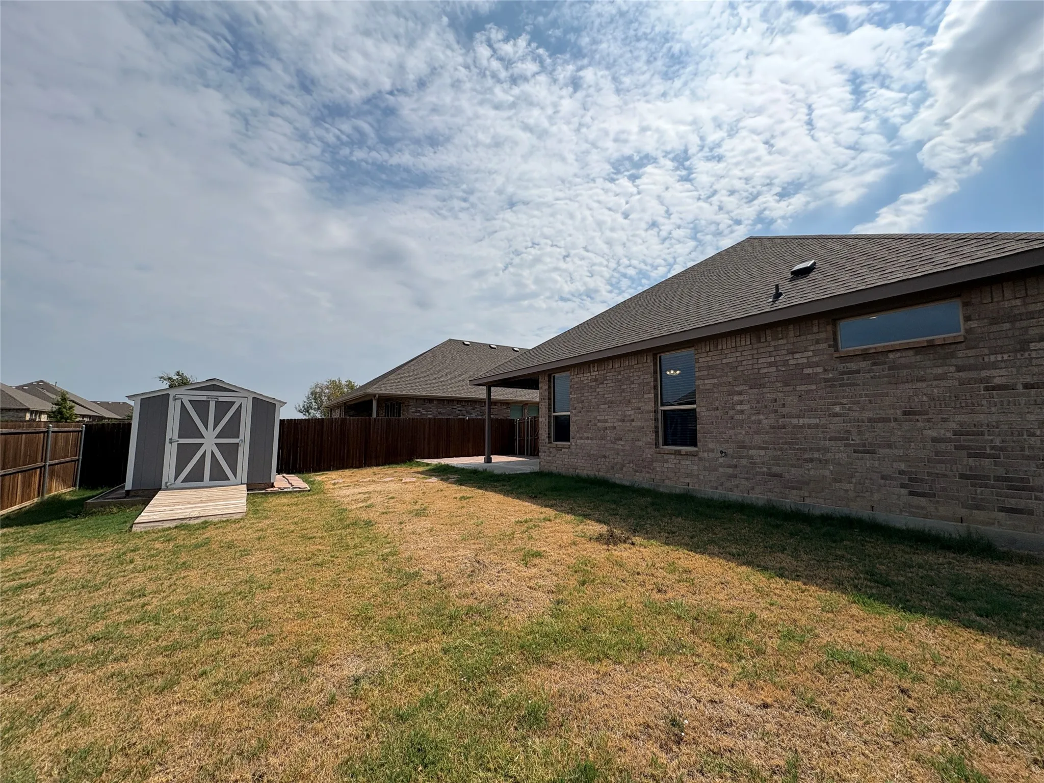 Large Covered Patio and Fenced backyard, shed