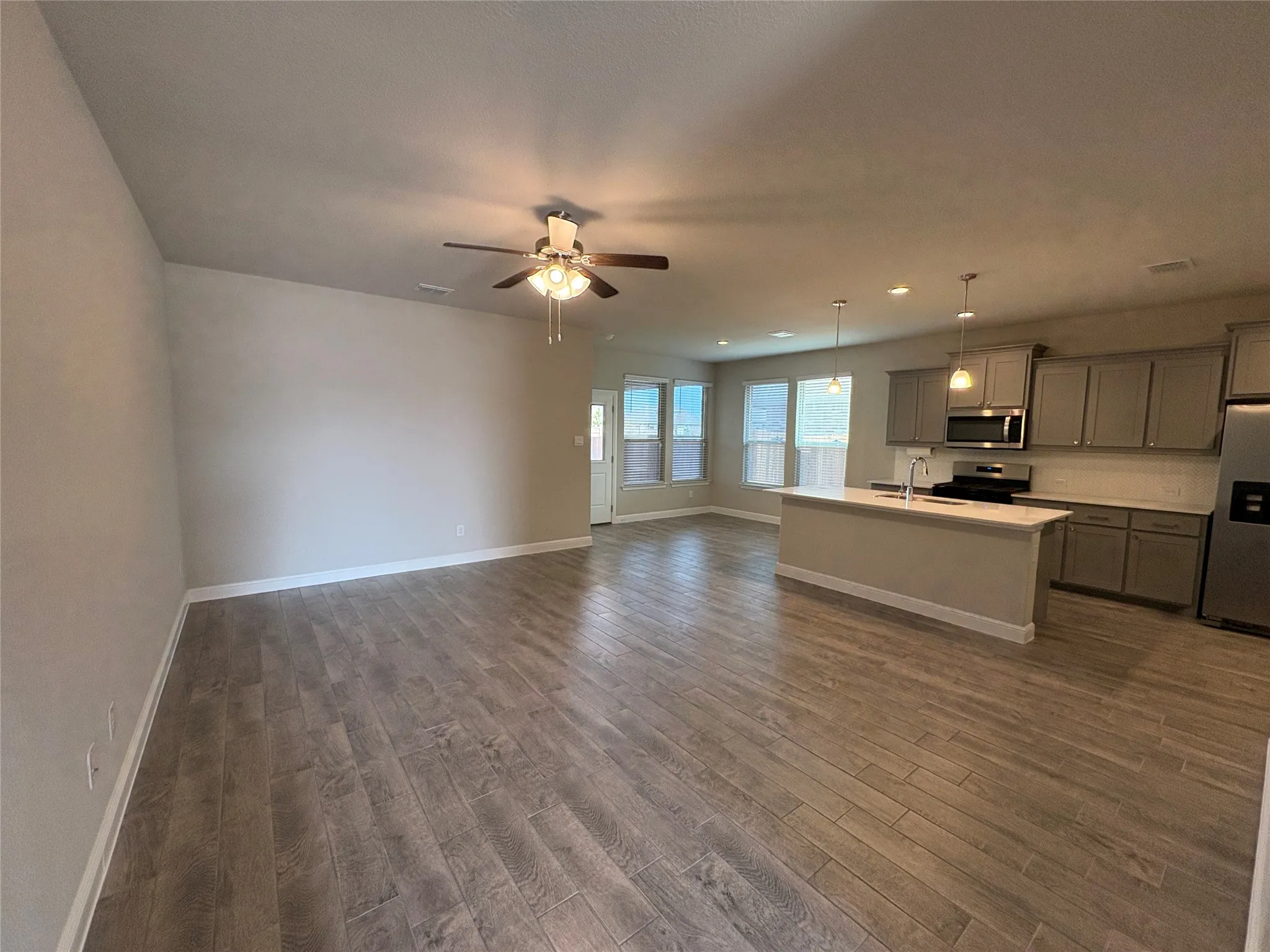 Living Room with tile flooring and ceiling fan