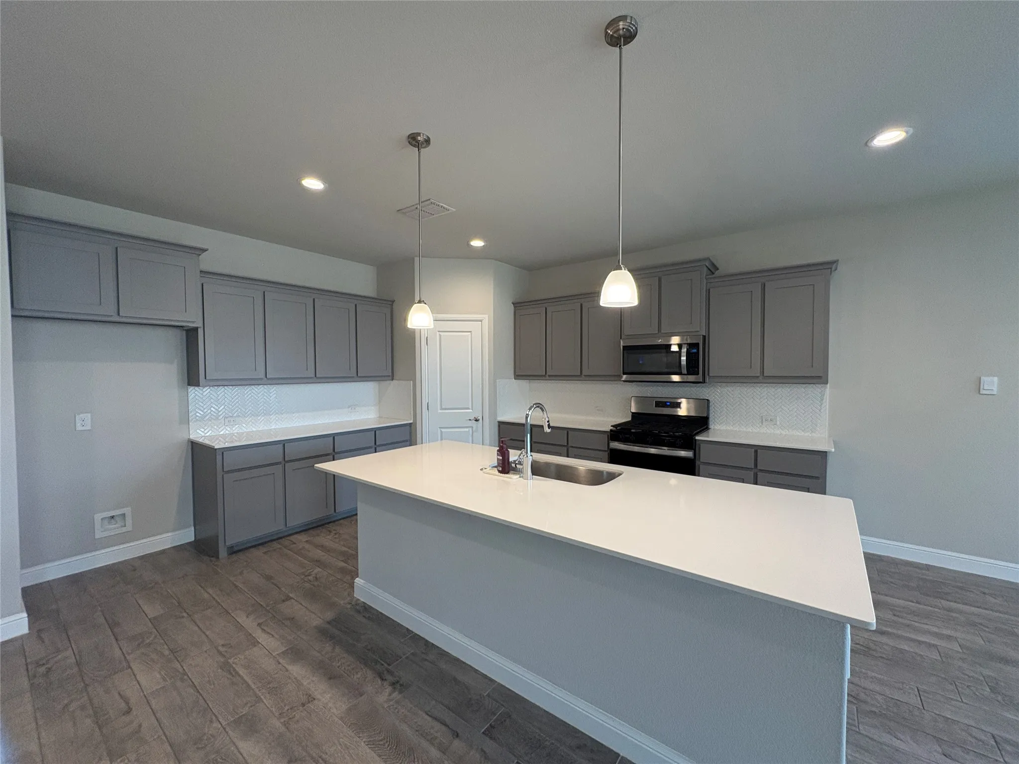 Kitchen with huge island and quartz countertops
