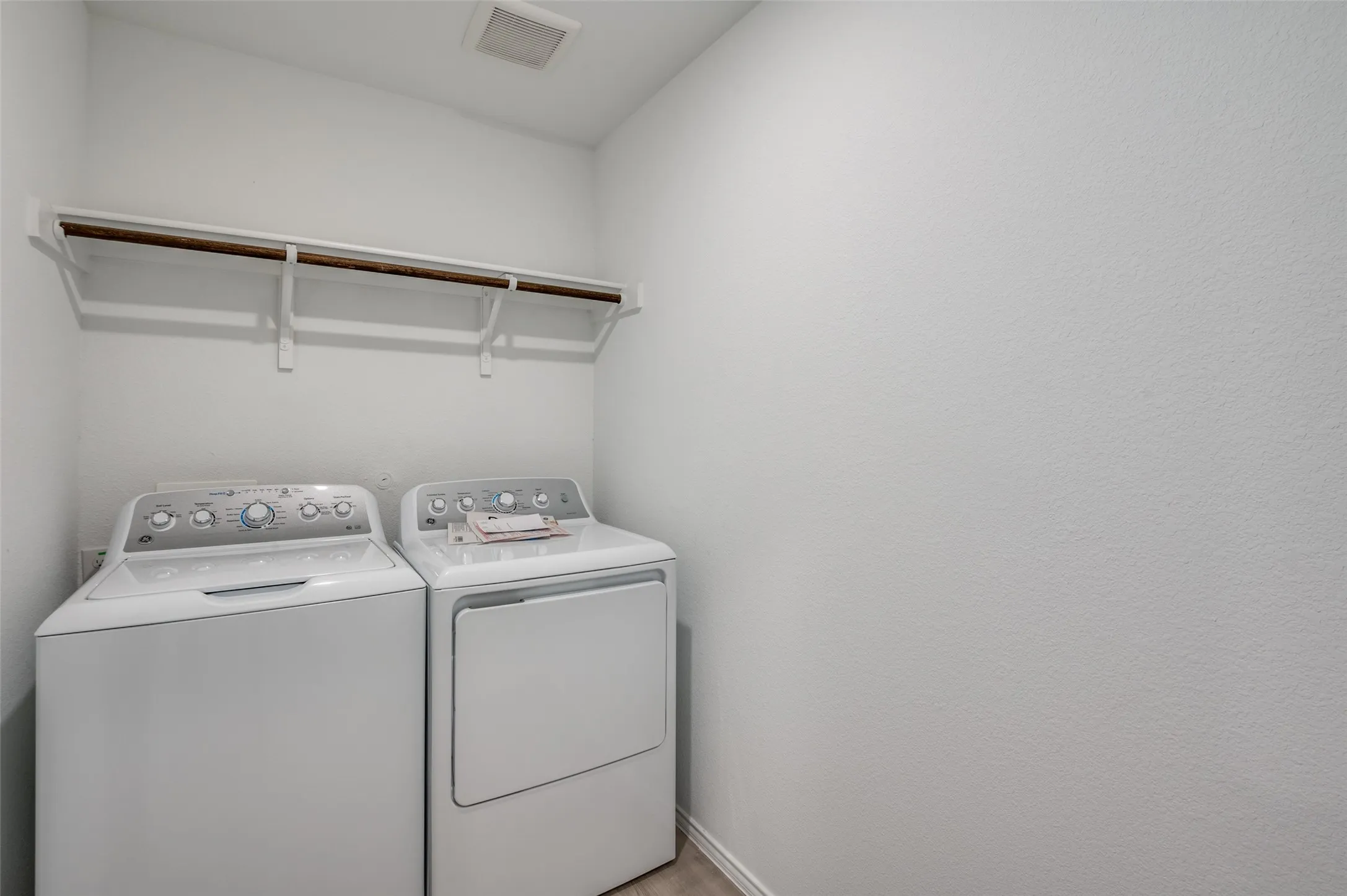 Laundry room with separate washer and dryer