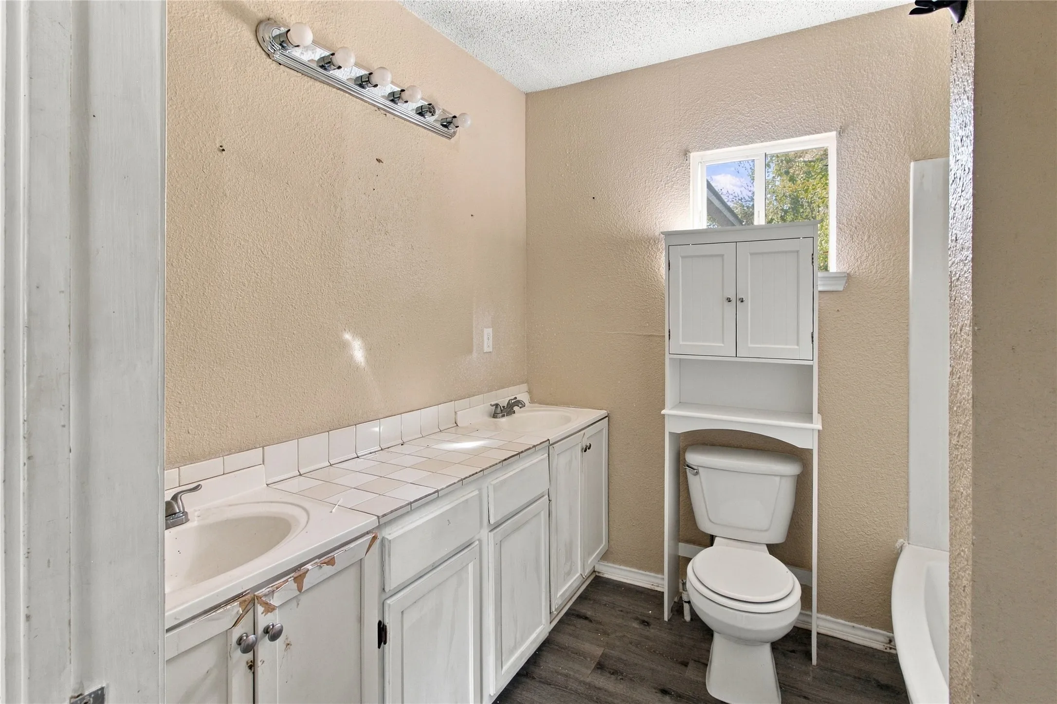 Dual vanity with white tile countertop
