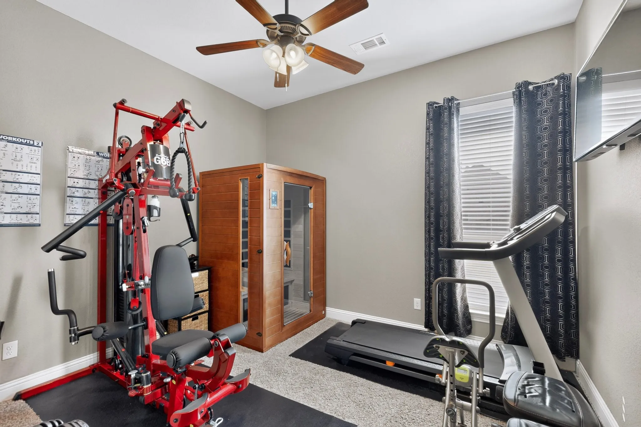 Recessed window with blinds, ceiling fan with integrated lighting, and neutral wall tones