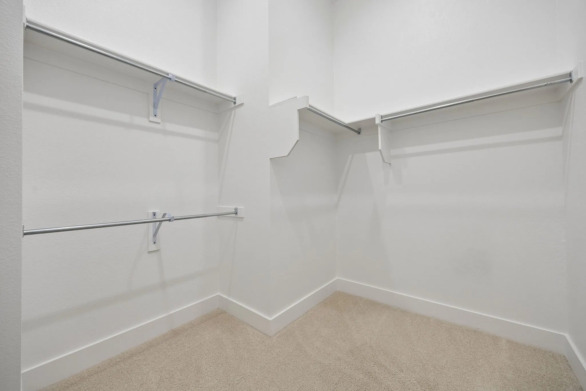 Primary Bathroom featuring Wall paneling with a two-tone paint scheme