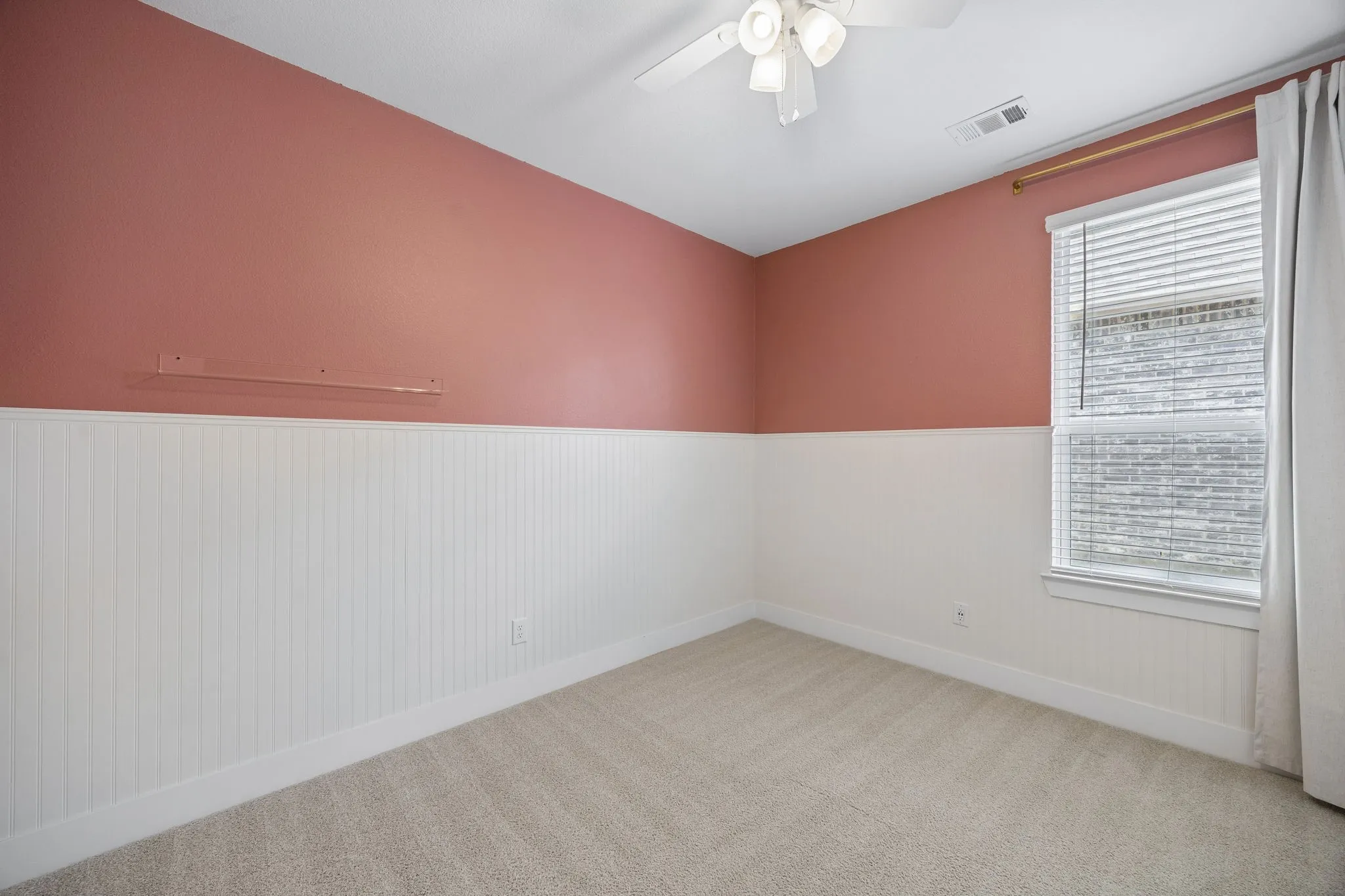 Secondary Bedroom #2 features Wall-to-wall carpeting, beadboard wall paneling, and a ceiling fan with integrated lighting