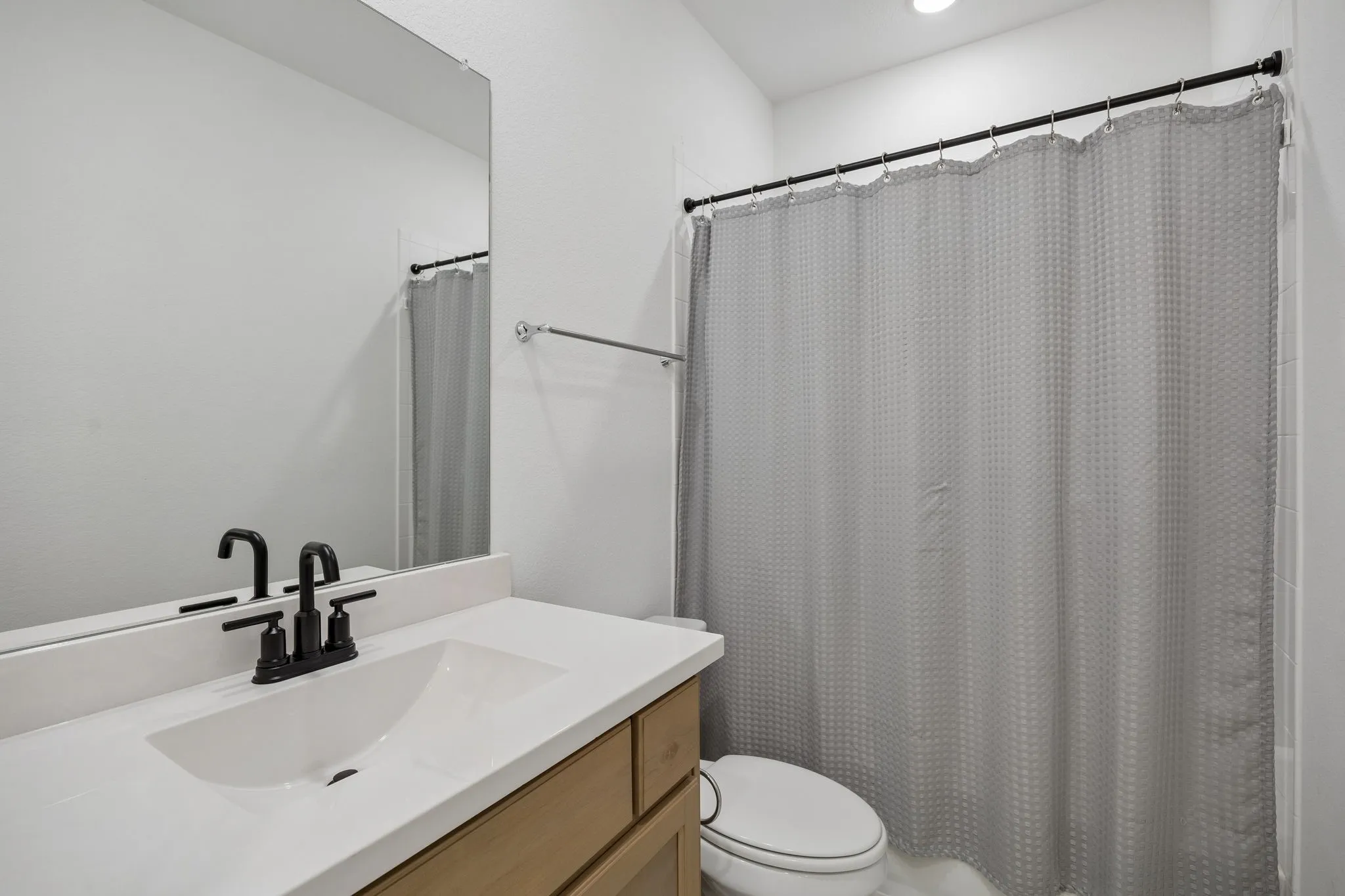 Neutral-toned walls complement the light-colored carpeting