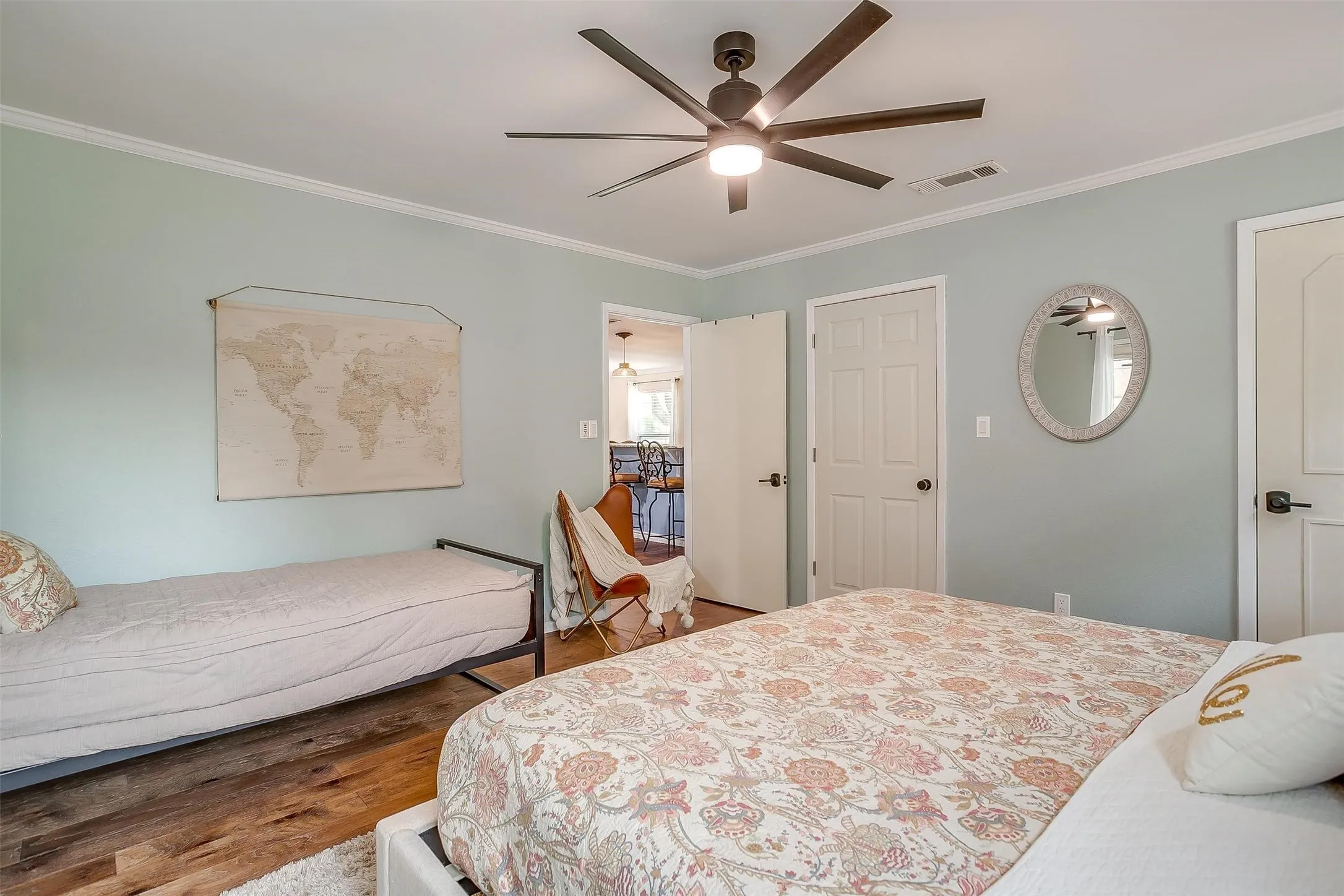 Wood-finish flooring with a light area rug
