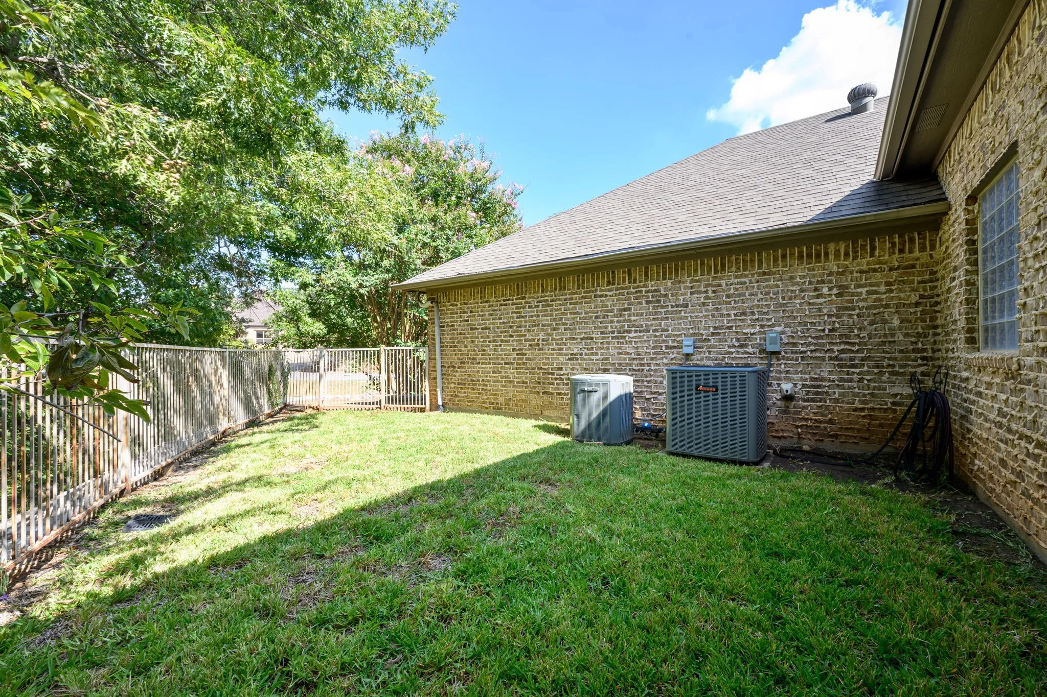 Spacious backyard with mature shade trees, lush lawn, for pets