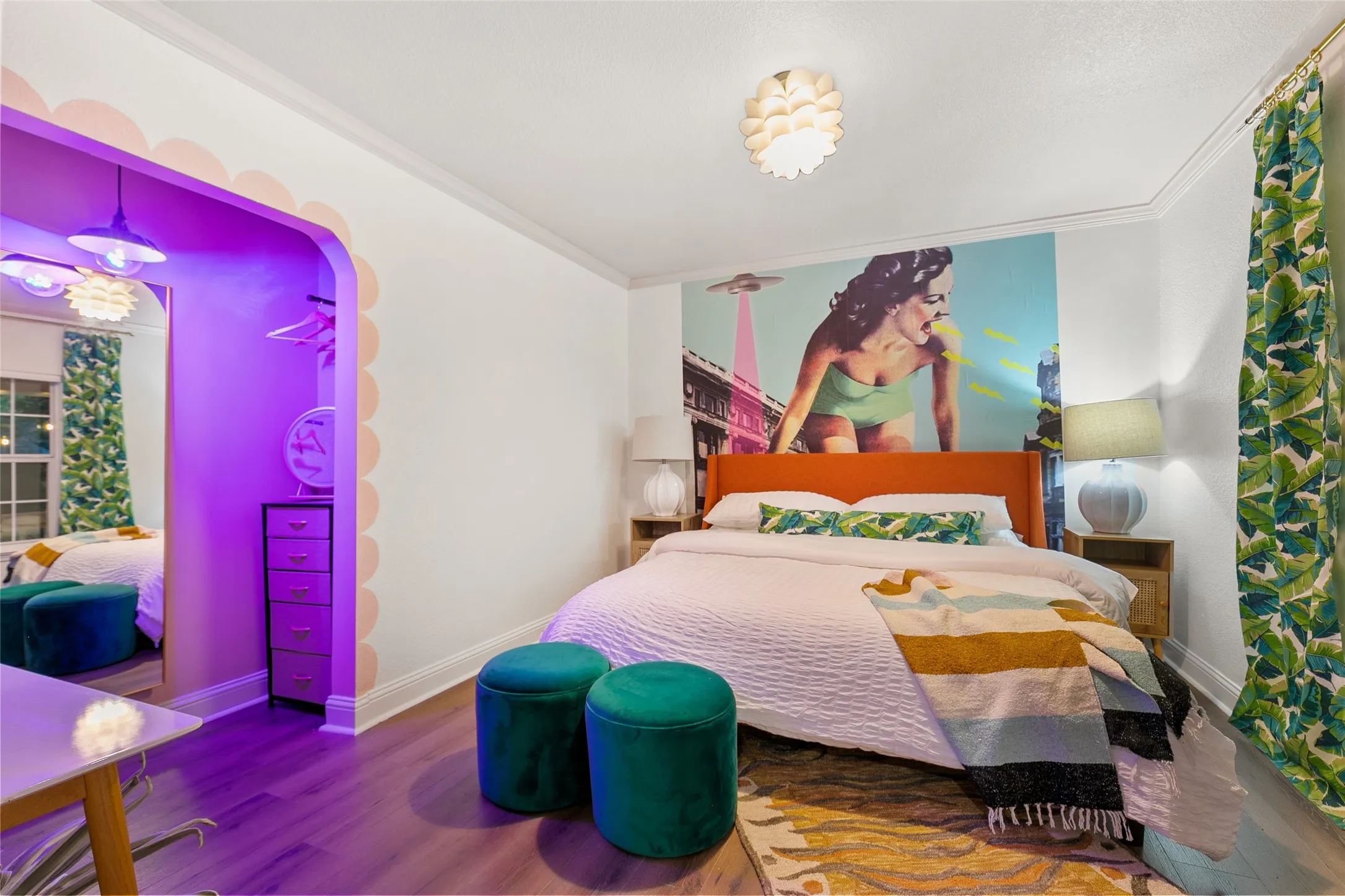 Wood-finish flooring, crown molding, and a built-in wall mural enhance this room