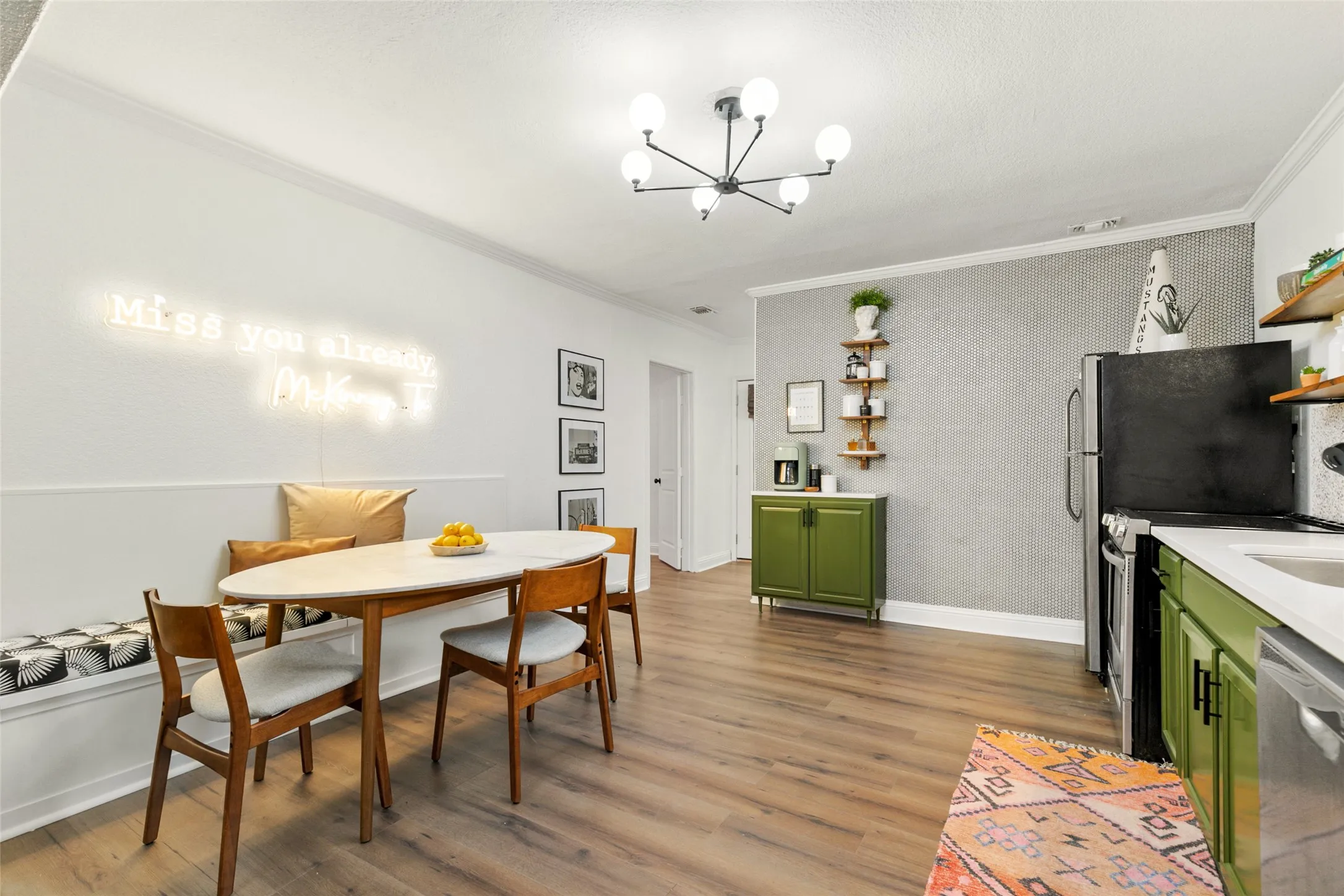 Wood-finish flooring throughout, complemented by a contemporary ceiling light fixture