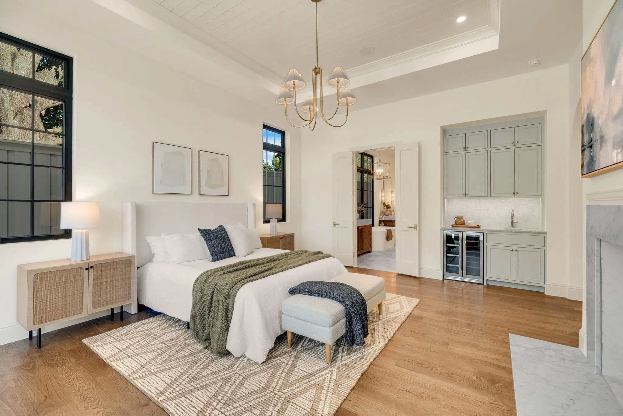 Tray ceiling with shiplap detail, recessed lighting, and a gold-finish chandelier