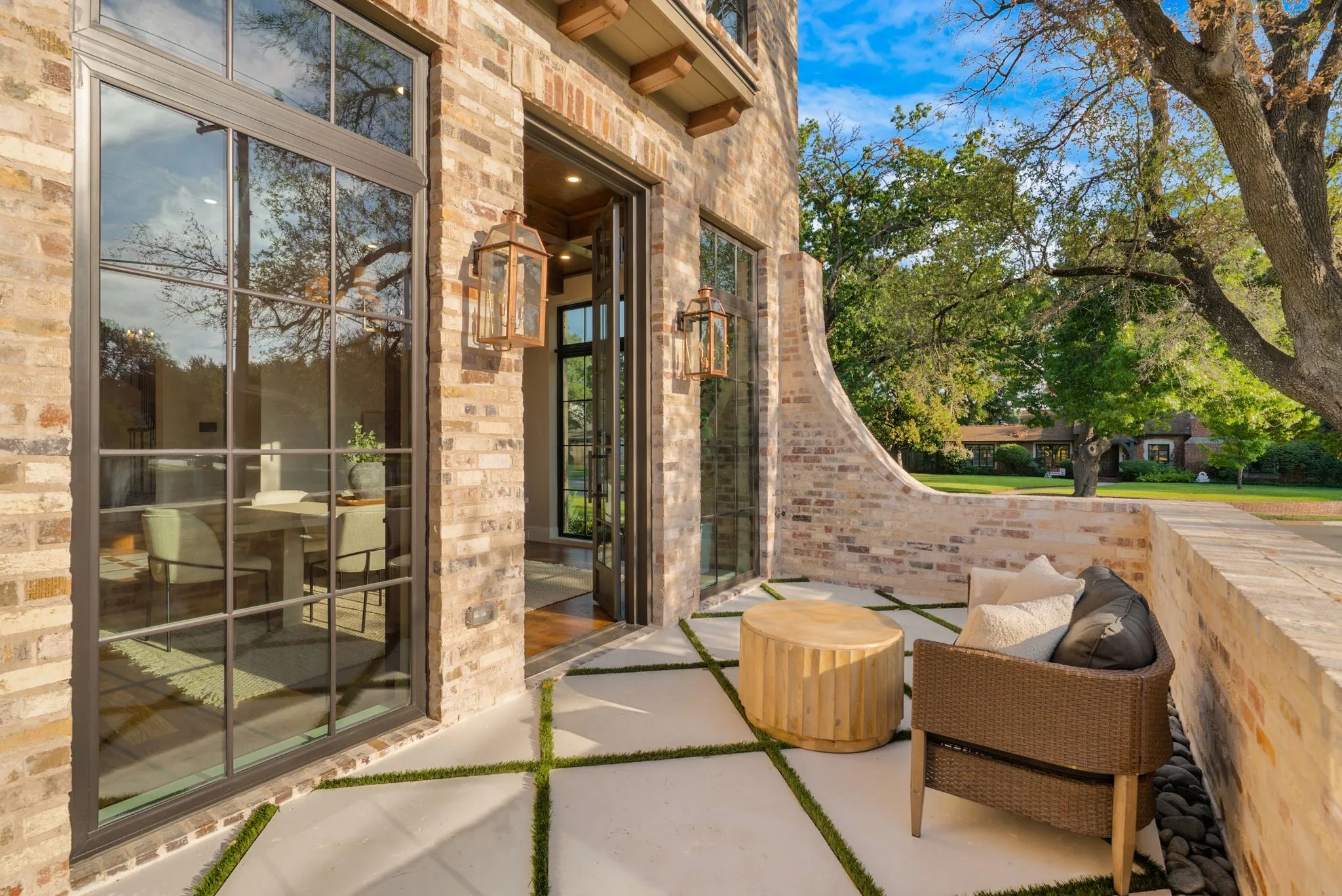 Brick exterior featuring multi-pane windows and a full-light folding door