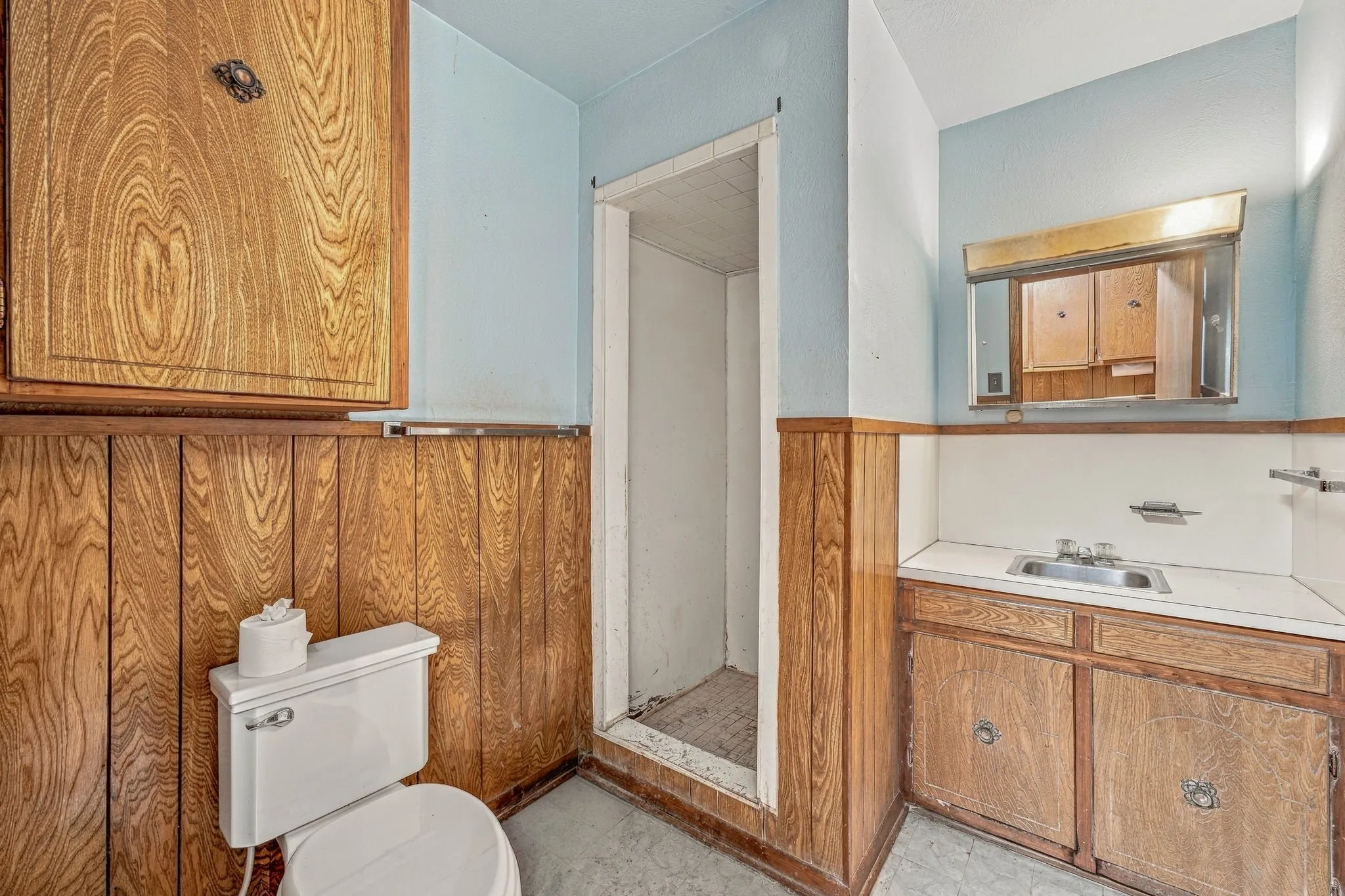 Wood-paneled wainscoting and cabinetry