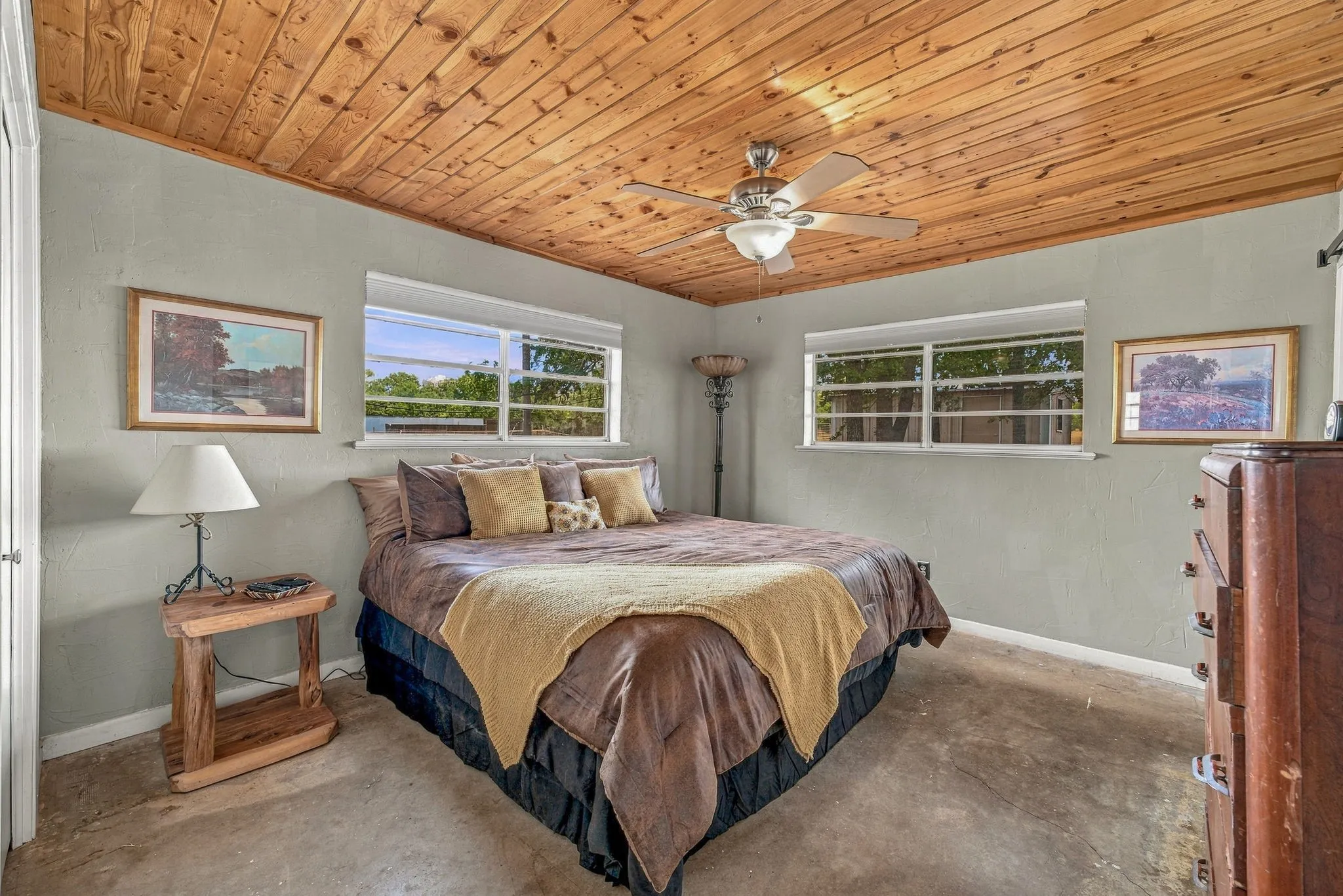 Wood-finish plank ceiling with a ceiling fan
