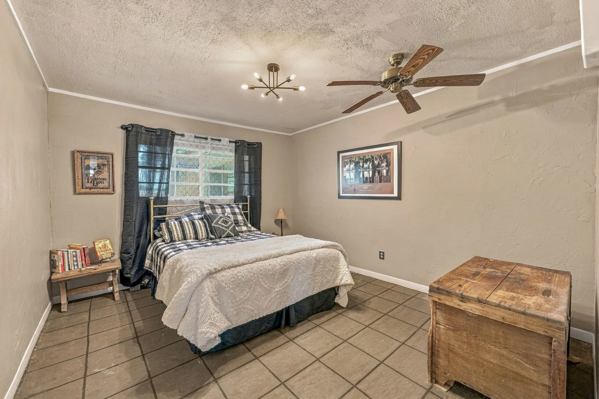 Tiled flooring, window with blinds and drapes, ceiling fan, and ceiling-mounted light fixture