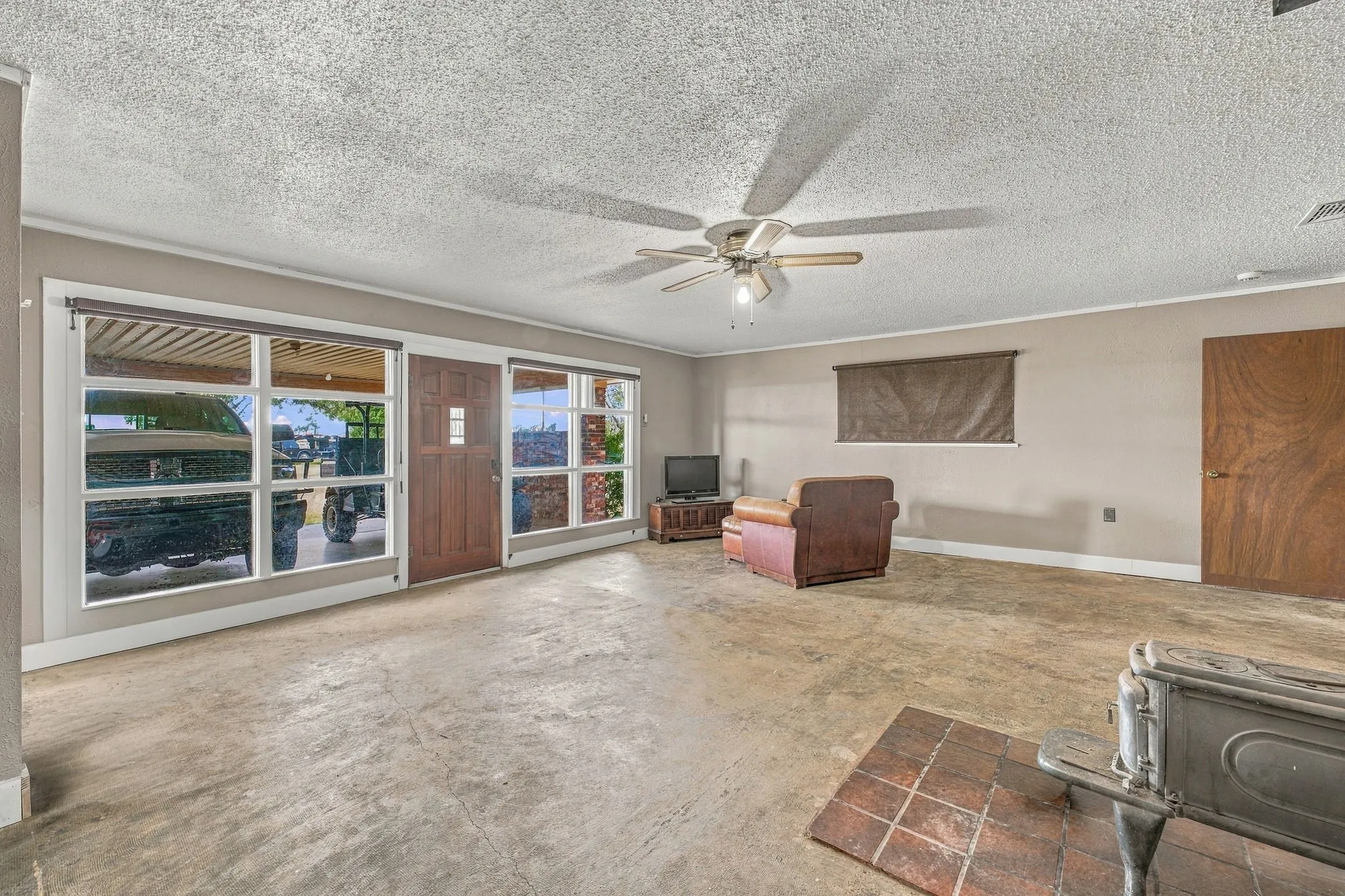 Front entry featuring a solid wood door and side panel windows