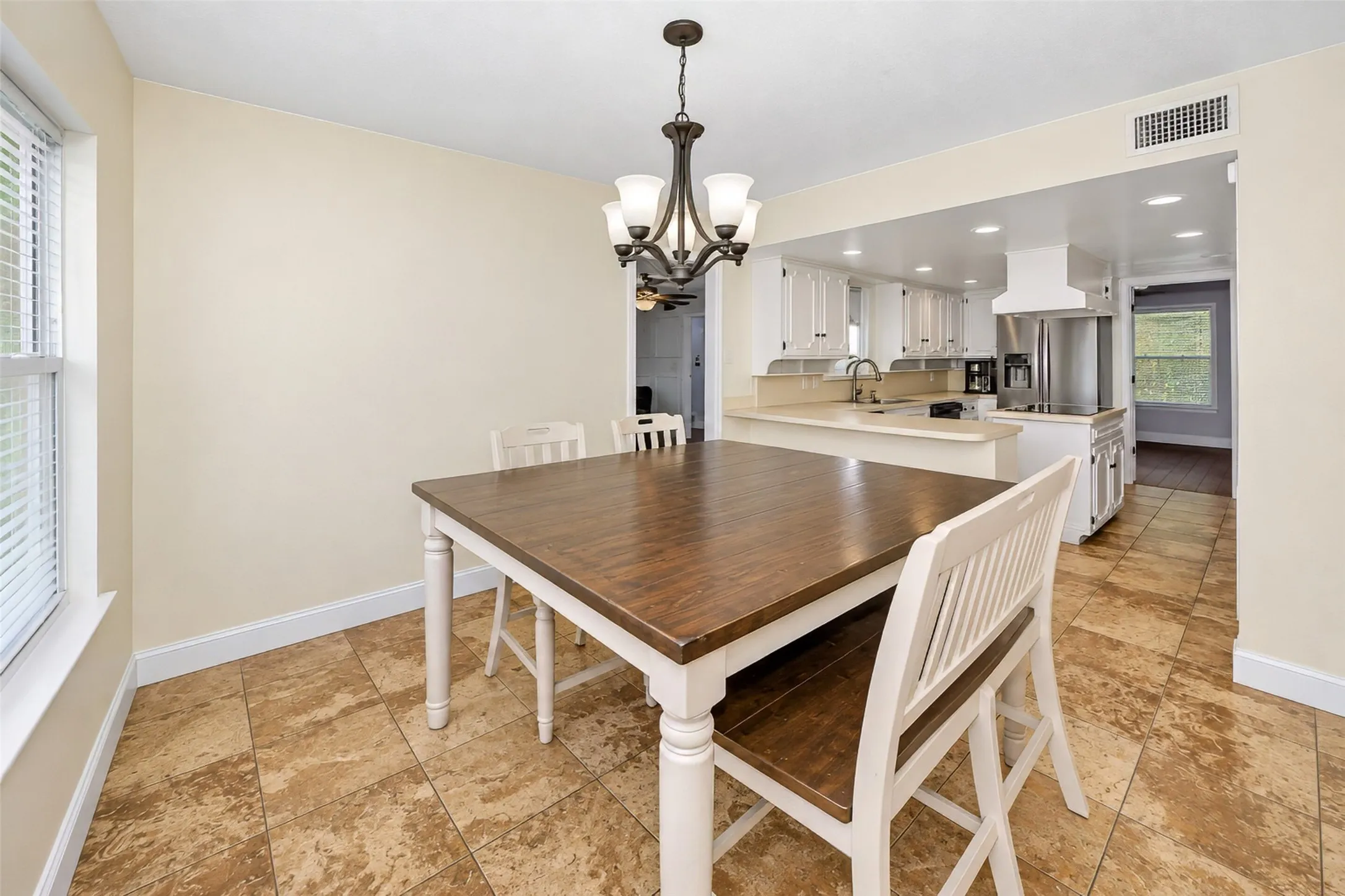 Warm-toned tile flooring throughout