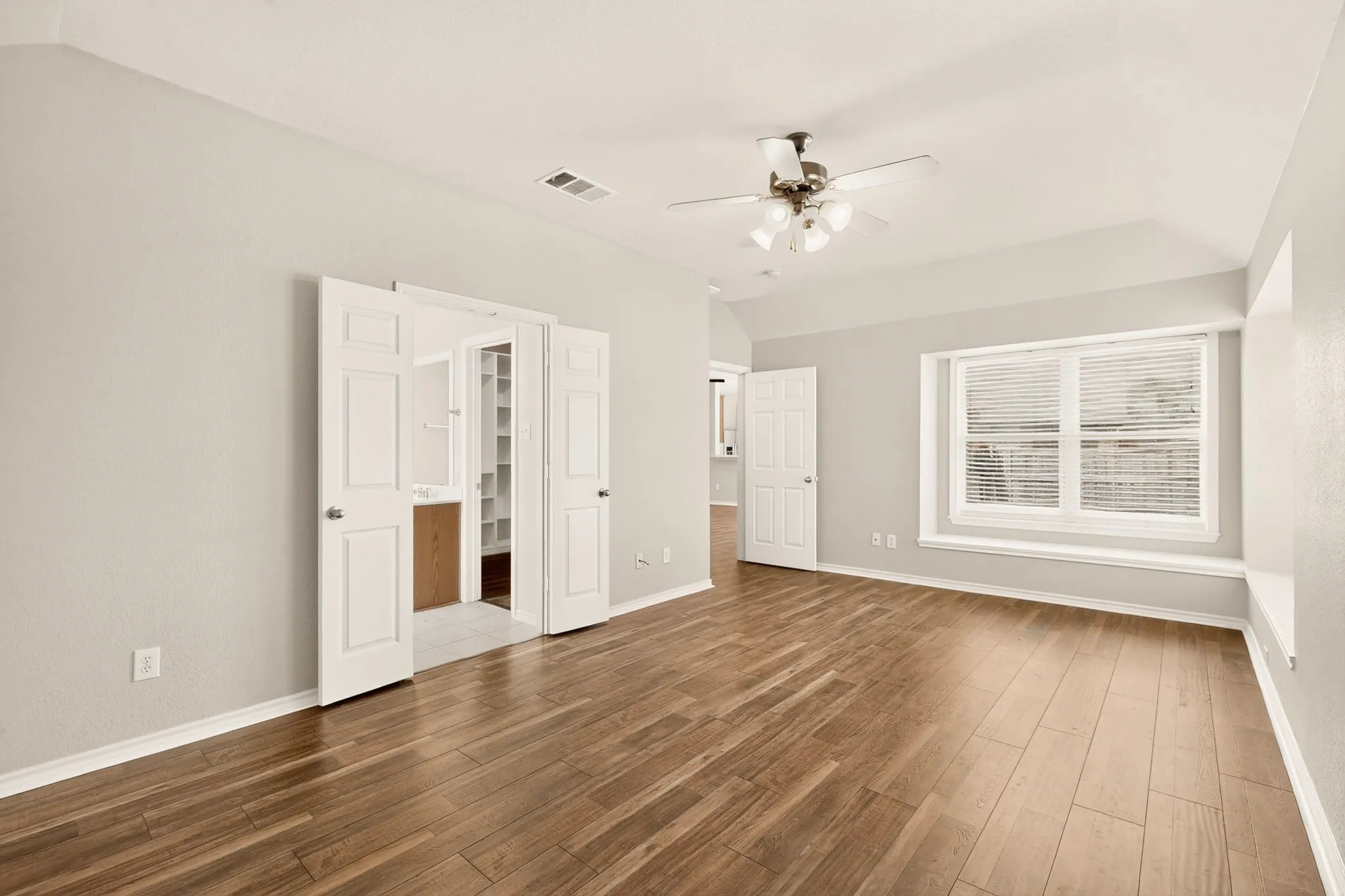 Double doors lead to bathroom