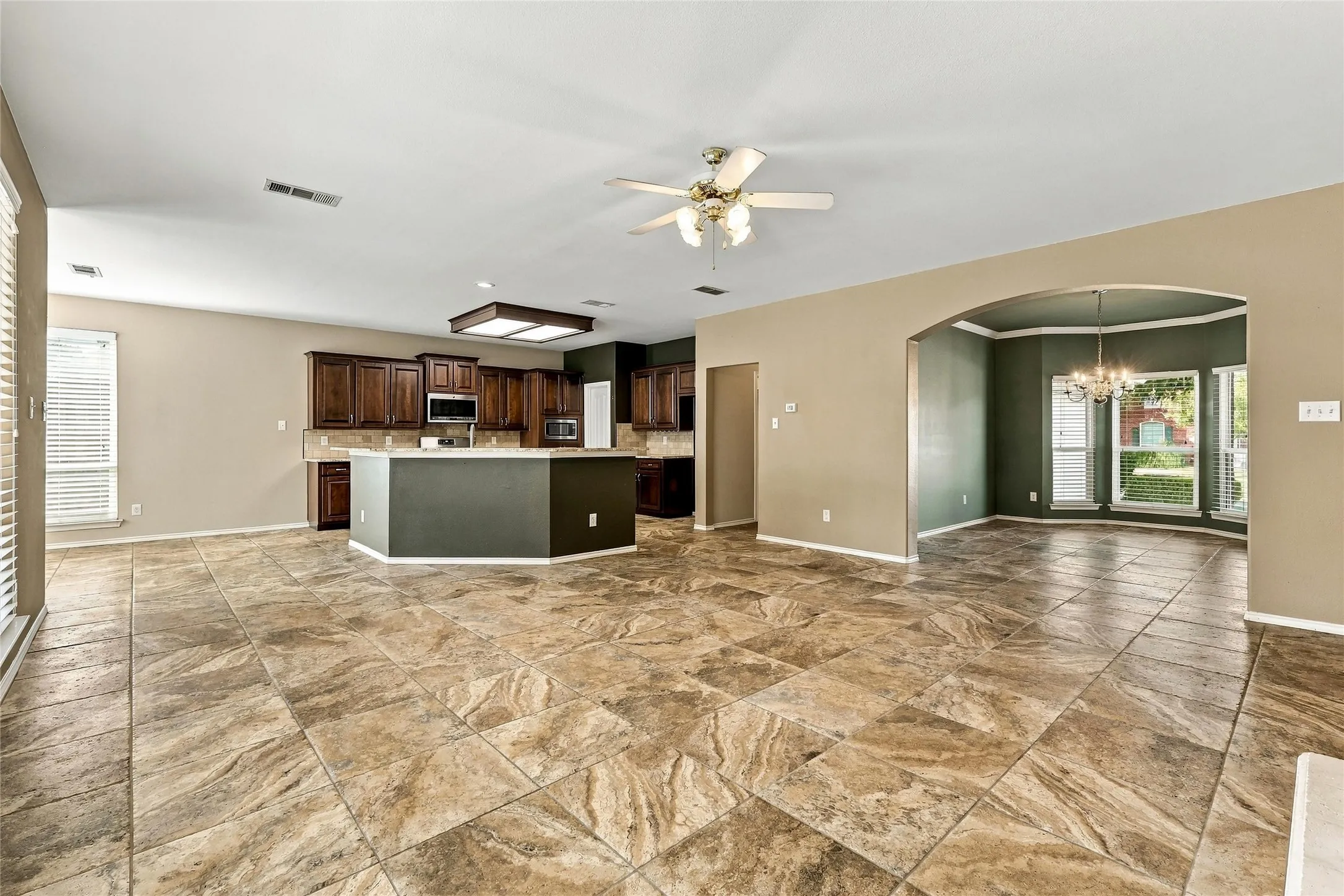 Living space flows wonderfully into kitchen, breakfast area