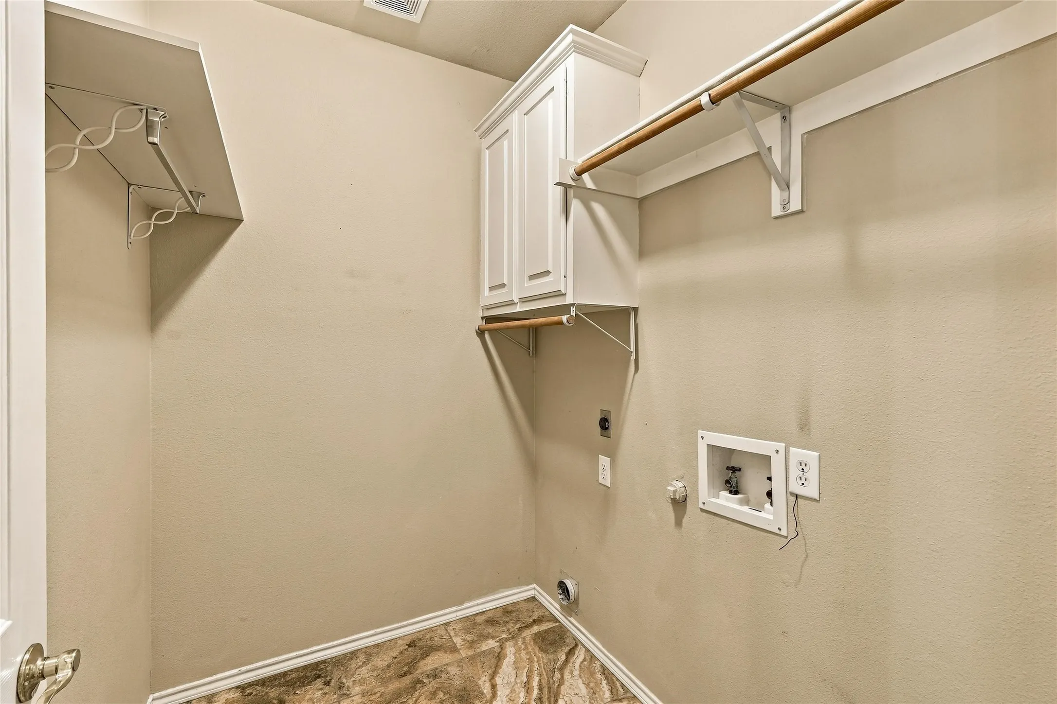 Laundry room has plenty of storage space
