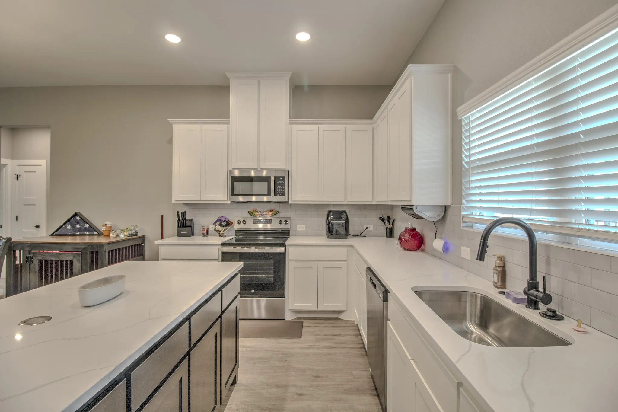 Beautiful cabinetry with farms style kitchen sink.