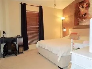 Primary bedroom with vaulted ceilings