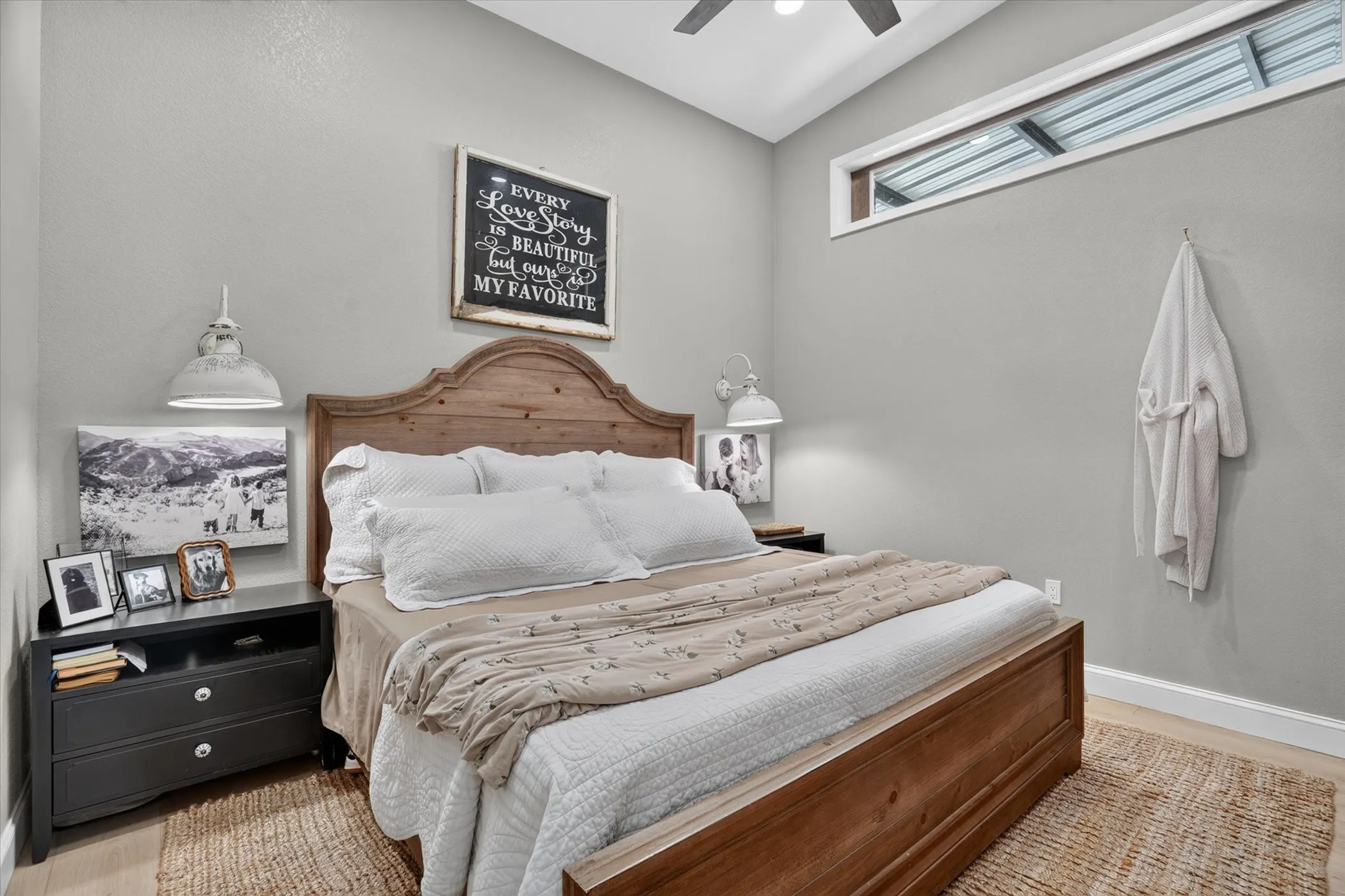 Vaulted ceilings, a high transom window, and wood-finish flooring