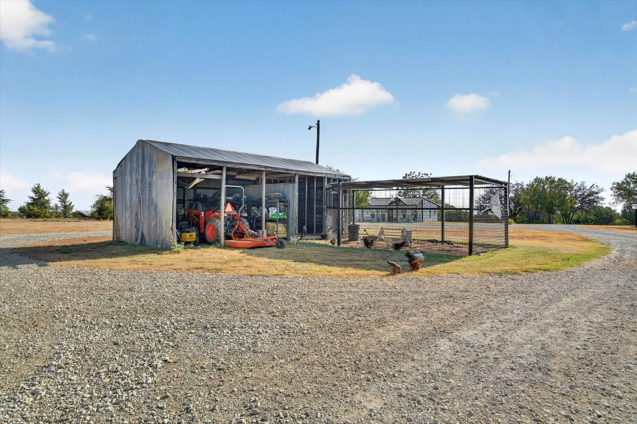 Utility structure featuring open-bay storage and metal roofing