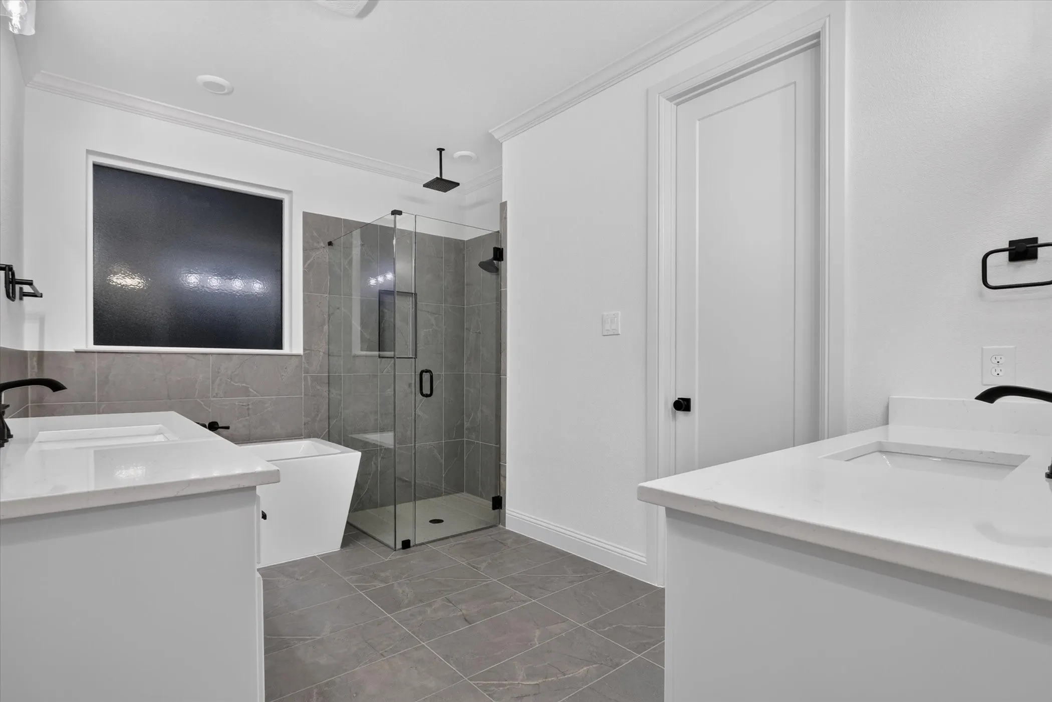 Dual vanity with undermount sinks and white countertops