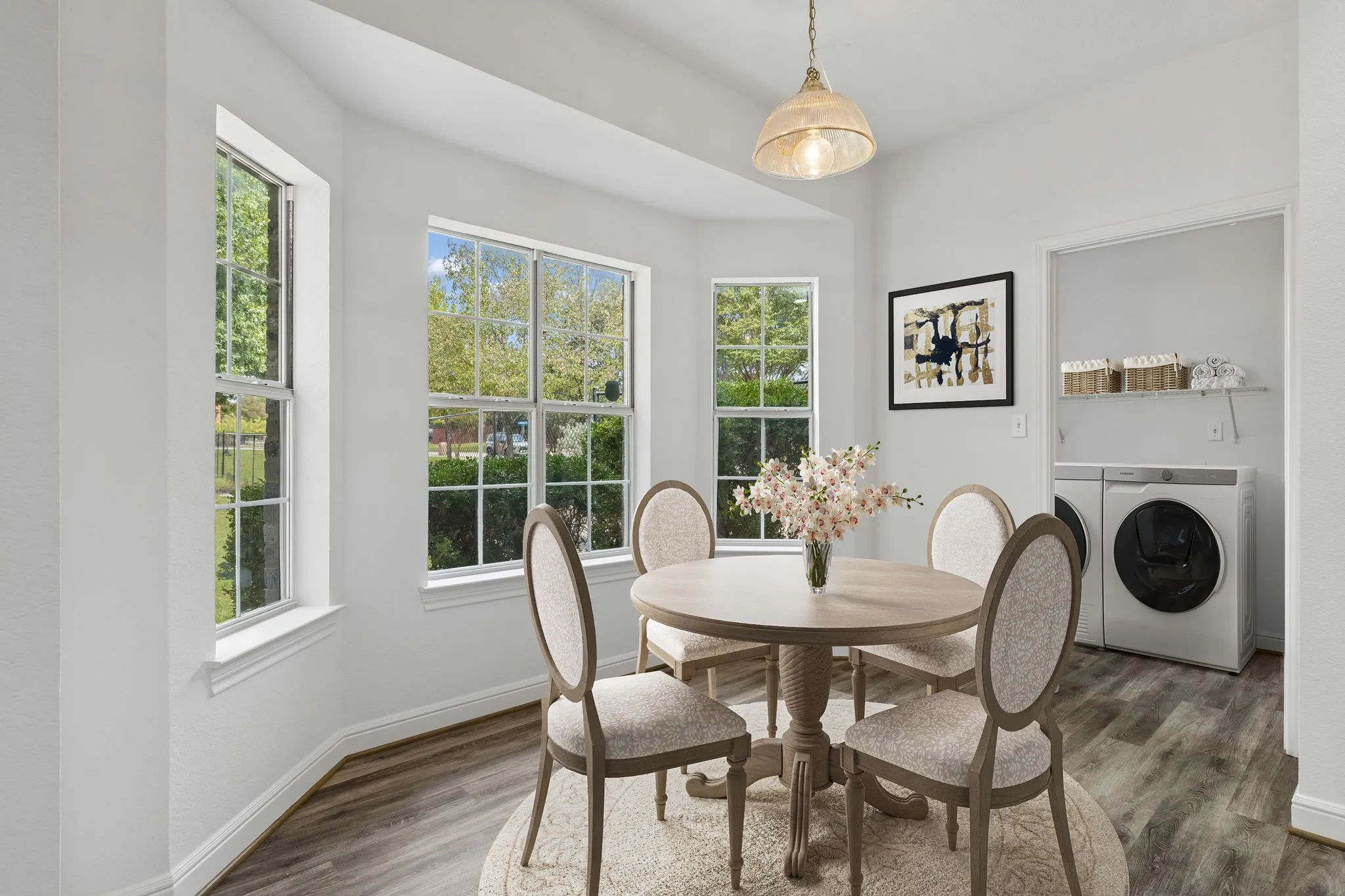 Virtually Staged Breakfast Nook overlooking the treed backyard