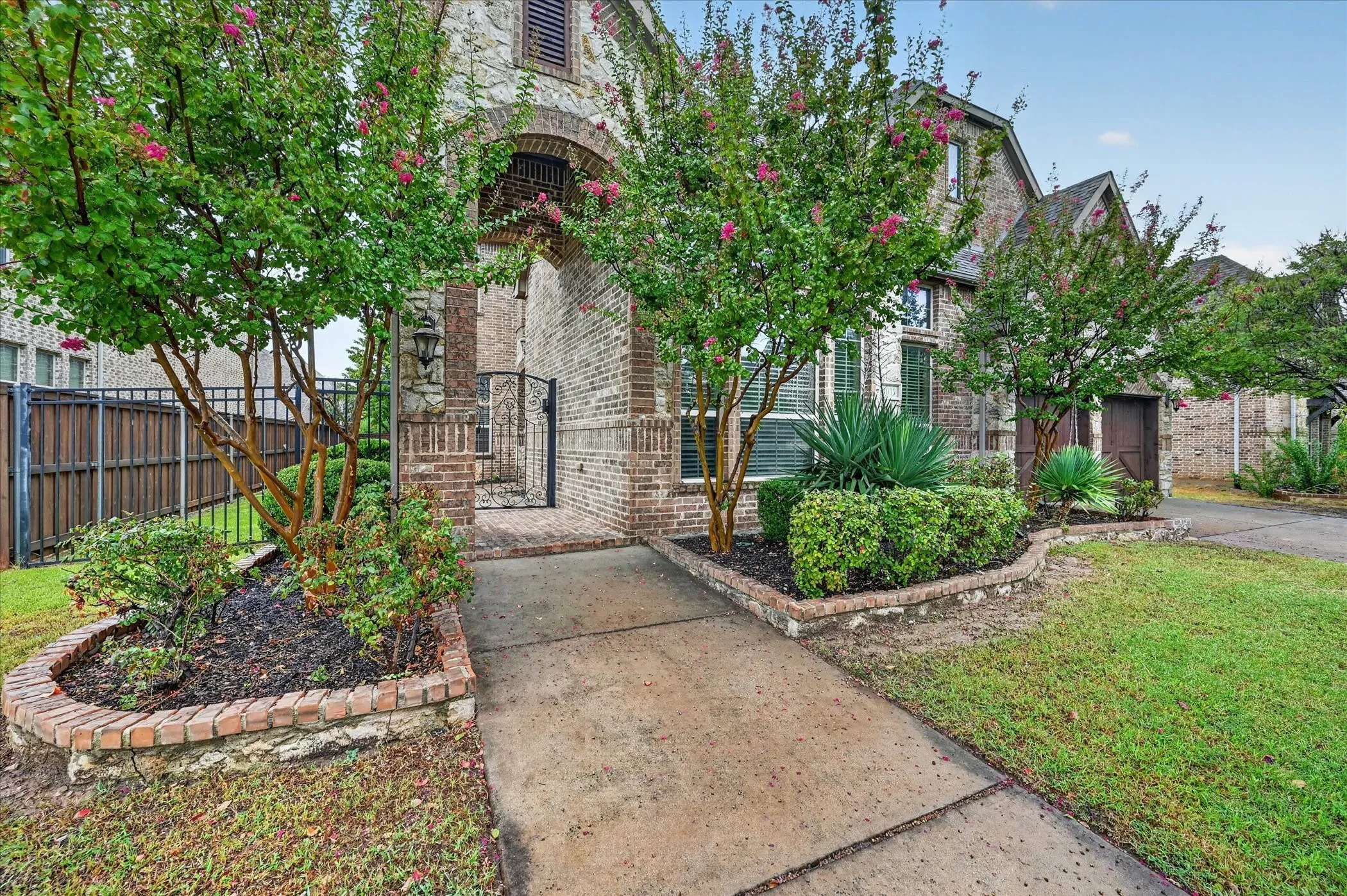 Brick and stone exterior with arched entryway