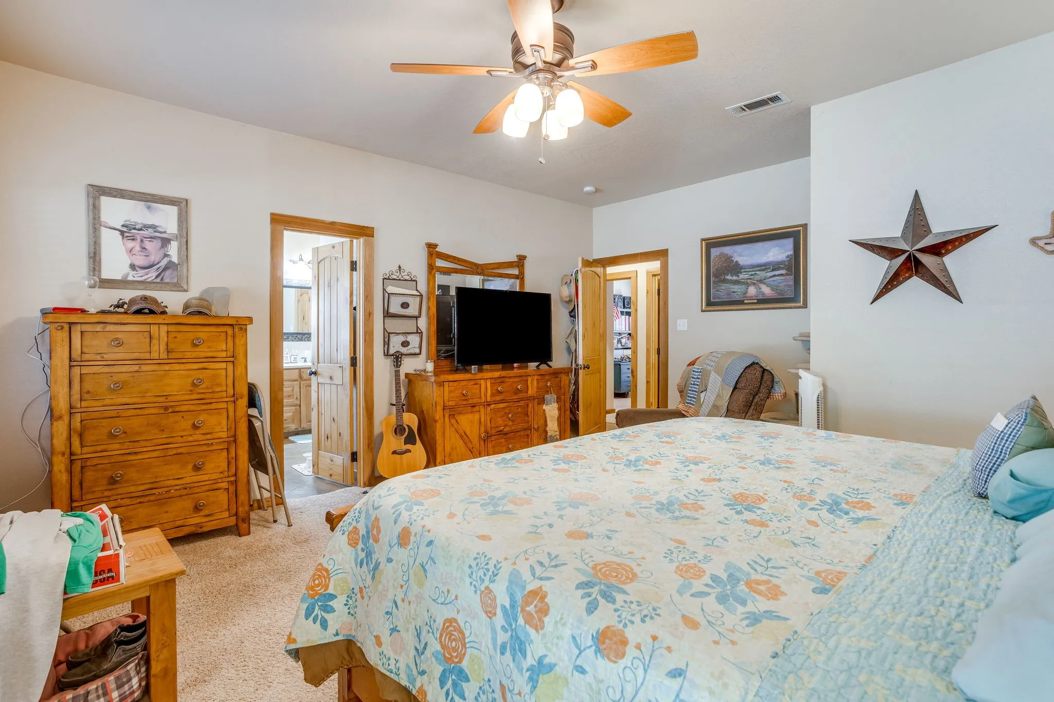 Carpeted flooring throughout, recessed lighting, and a ceiling fan with light fixture