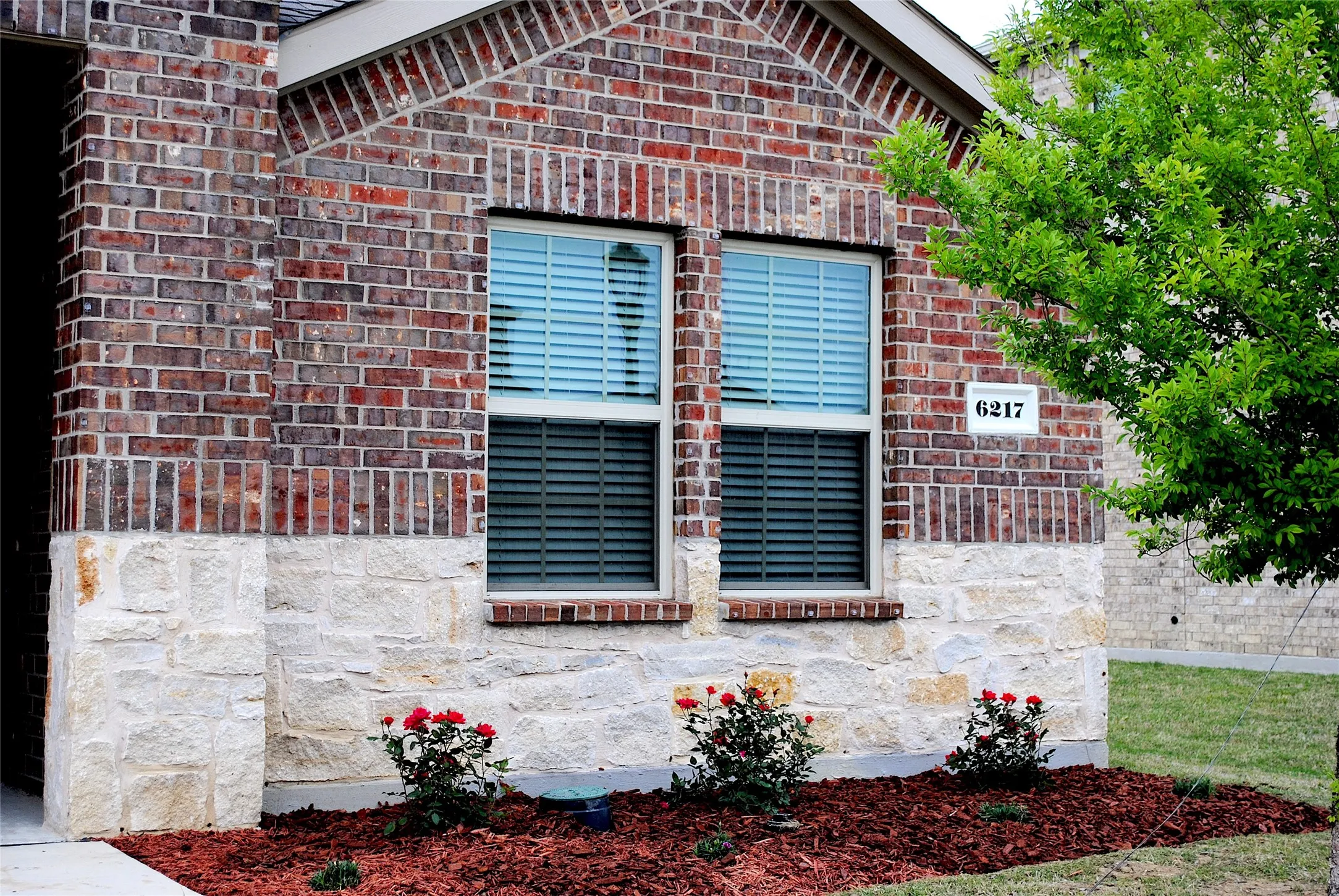Brick and stone exterior with architectural detailing