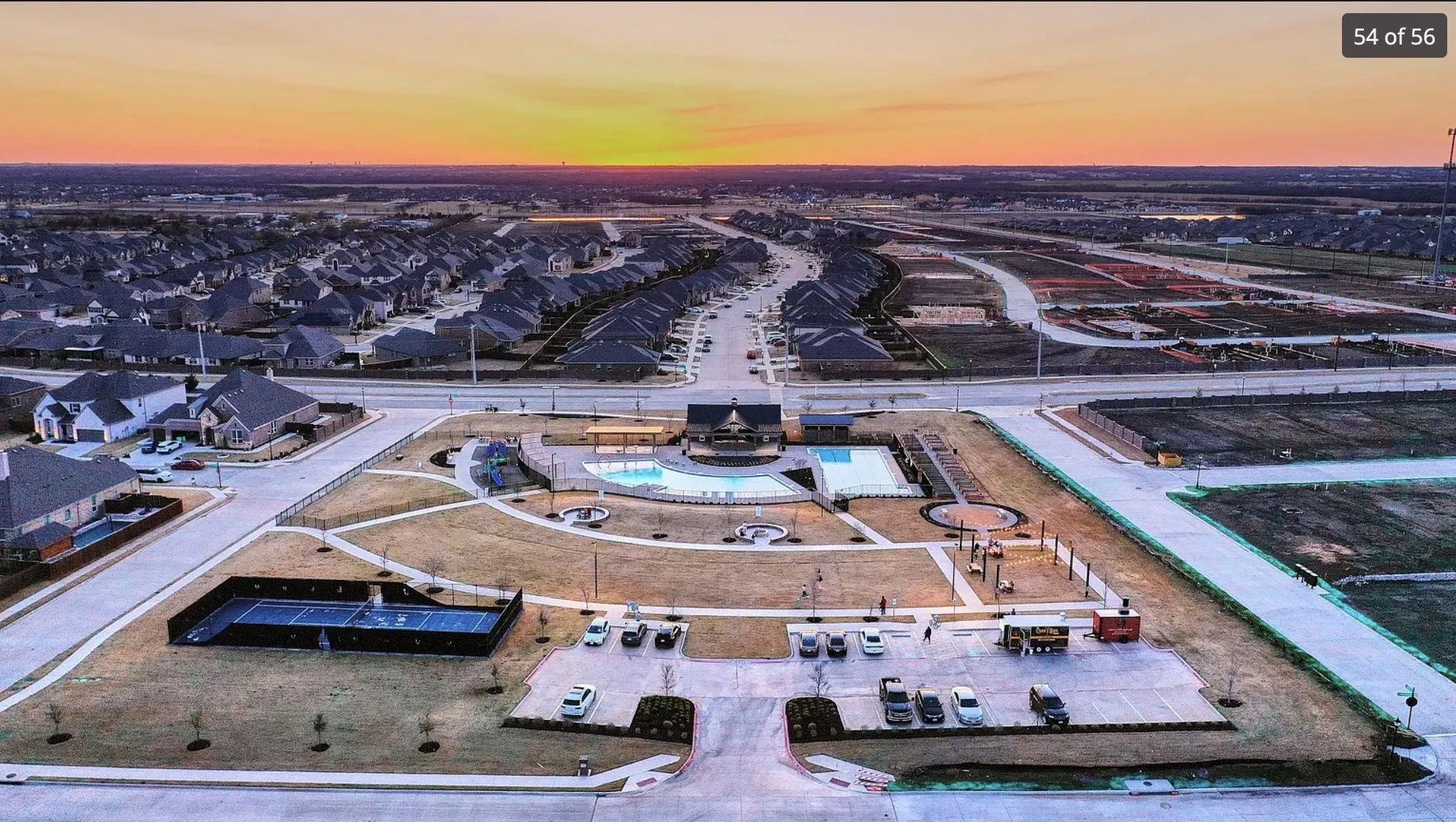 Expansive community amenities including a swimming pool, basketball court, and paved pathways