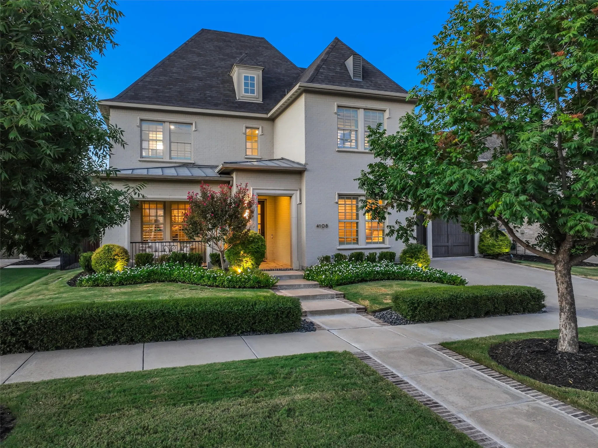 Welcome to a home where timeless elegance, thoughtful design, and resort-style living come together beautifully. From the moment you arrive, the landscaped front yard and inviting covered front porch with a charming porch swing set the tone for the exceptional spaces found throughout the home. • Whole-house audio: in-ceiling speakers in the living room, dining room, primary bedroom, and outdoor patio and pool area
• Water filtration: whole-house filtration system plus reverse osmosis drinking water
• New HVAC system installed May 2026
• Plantation shutters on the front of the home
• Electric shades on the back of the home