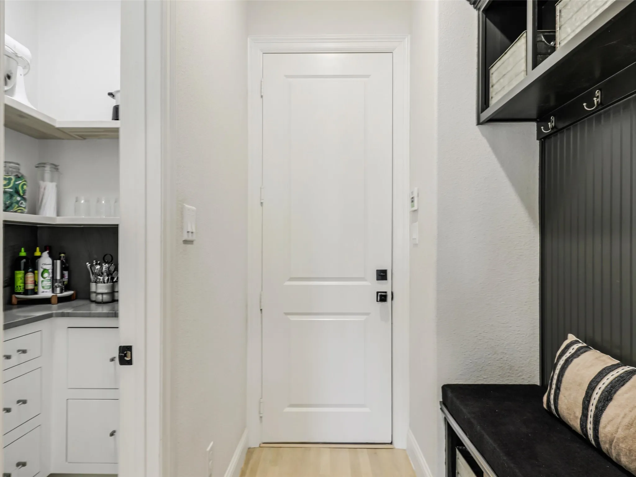 A functional mudroom with built-in storage complete the main level.