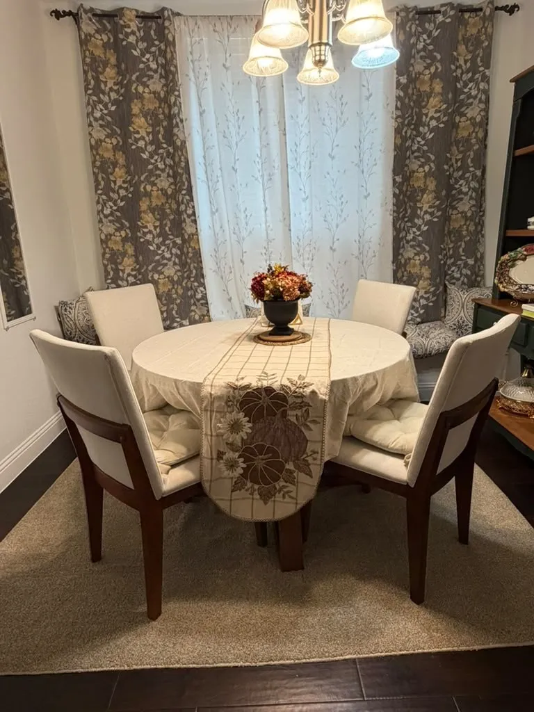 Hardwood flooring, chandelier lighting, and decorative wall hangings