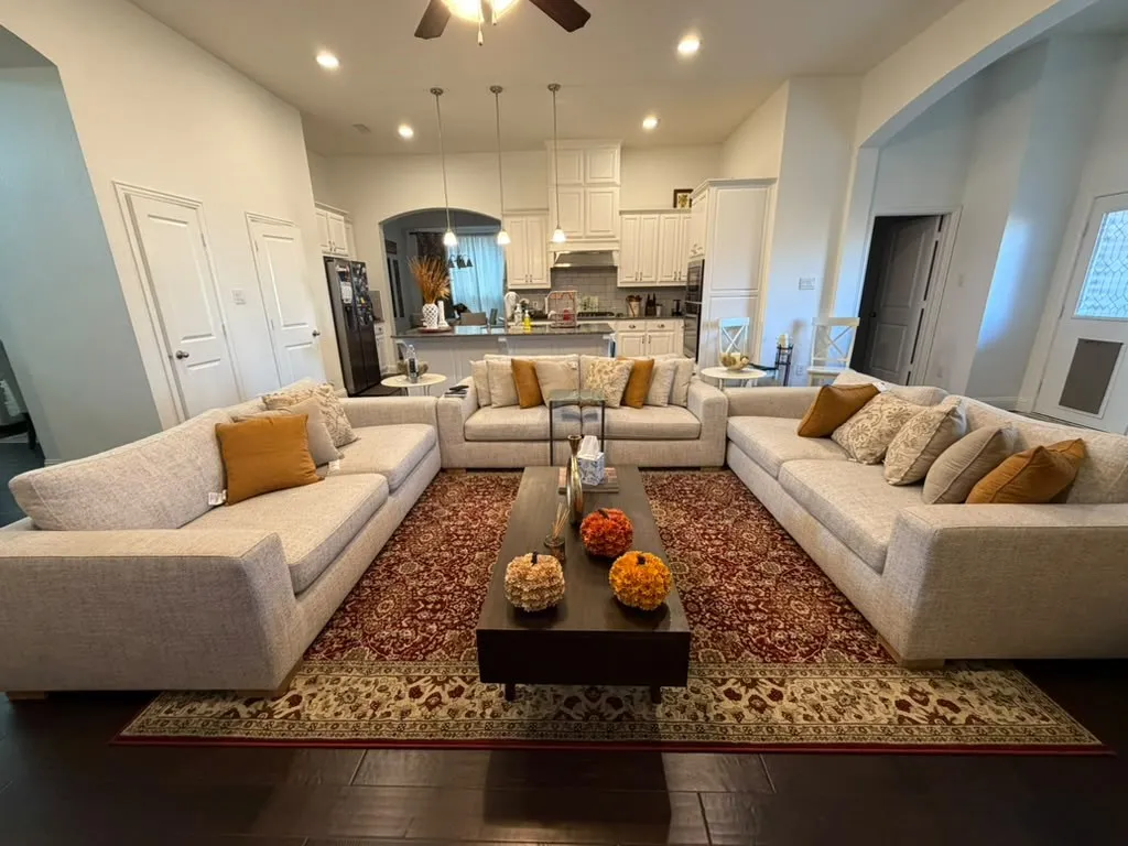 Open-concept living area with dark wood-finish flooring, recessed lighting, and a ceiling fan