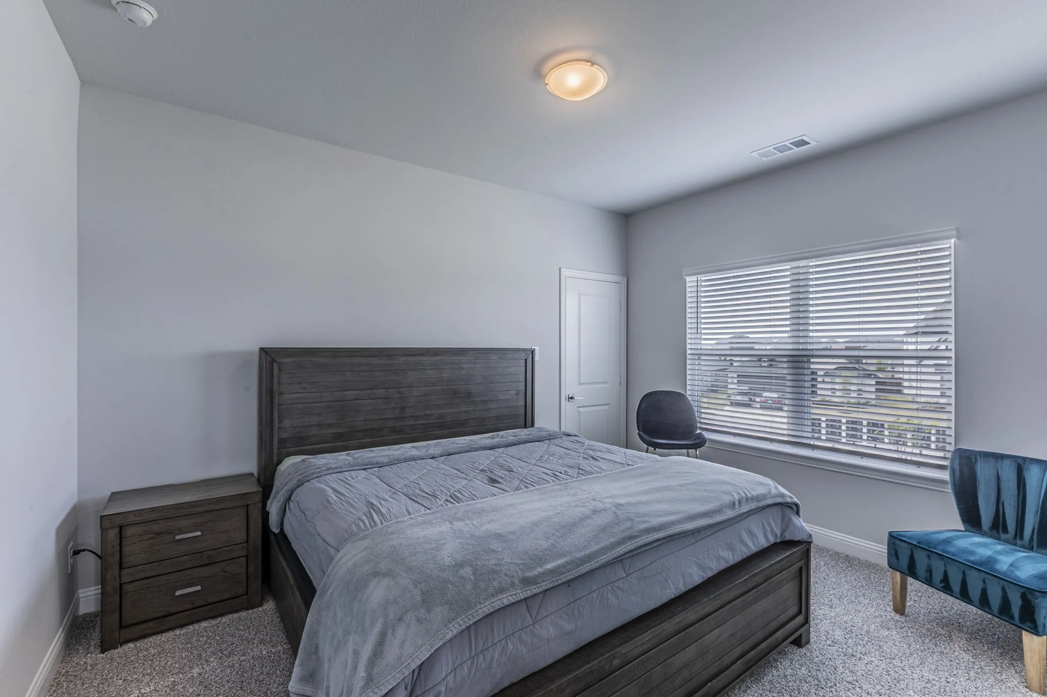 Carpeted bedroom with baseboards
