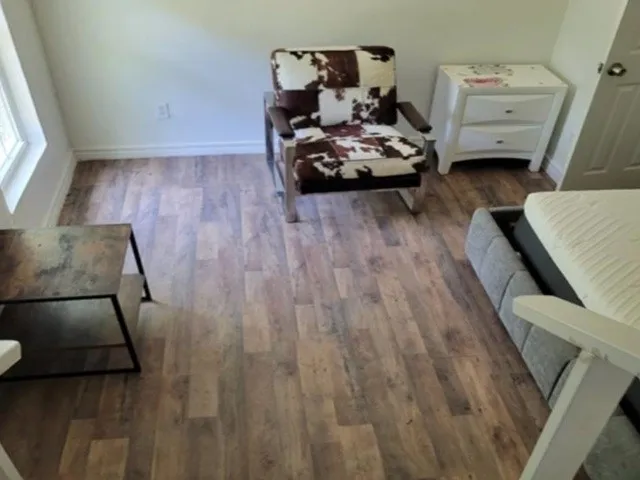 Wood-finish flooring throughout the space