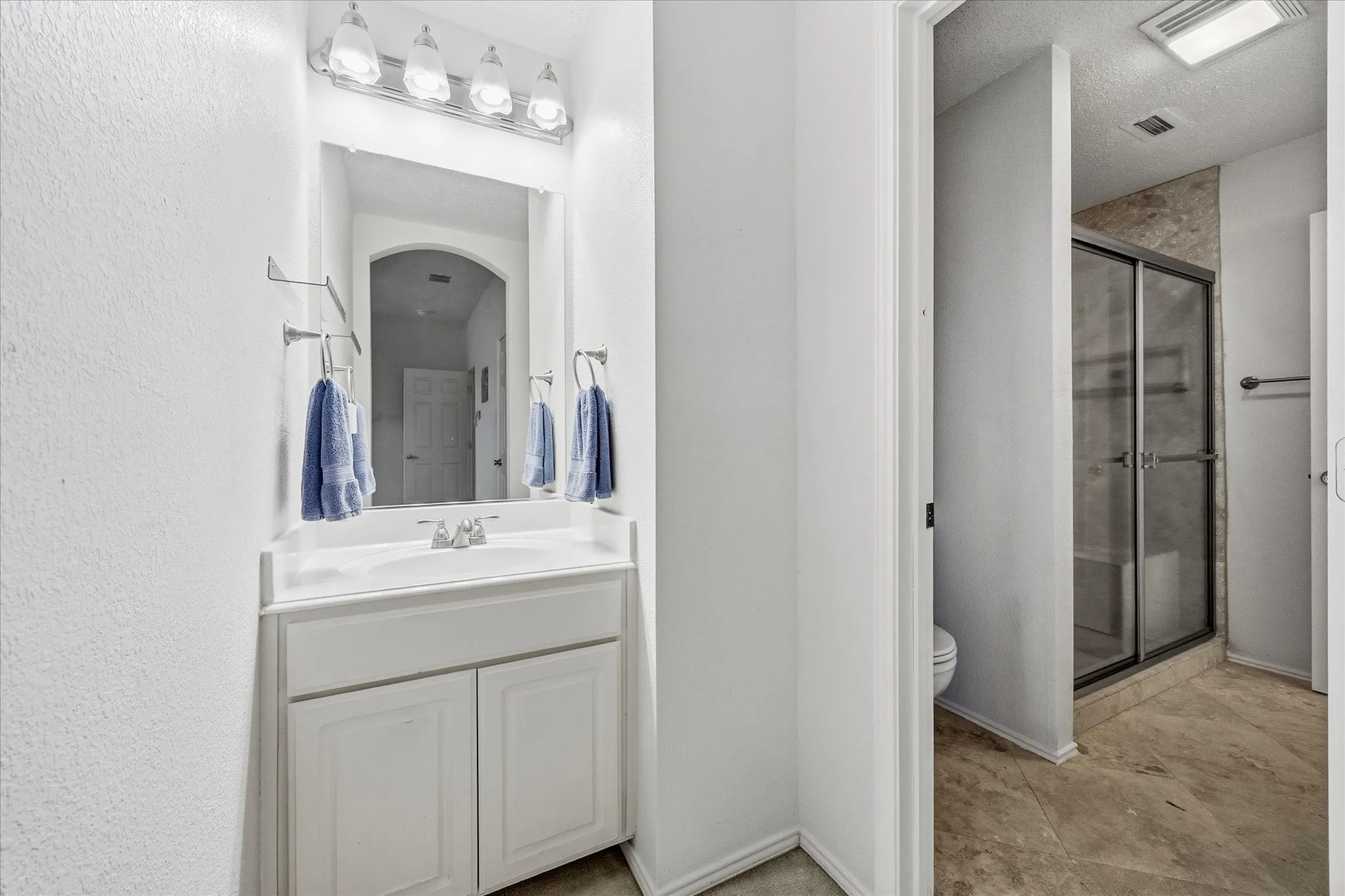 Jack and Jill bath opens onto auxiliary bedrooms