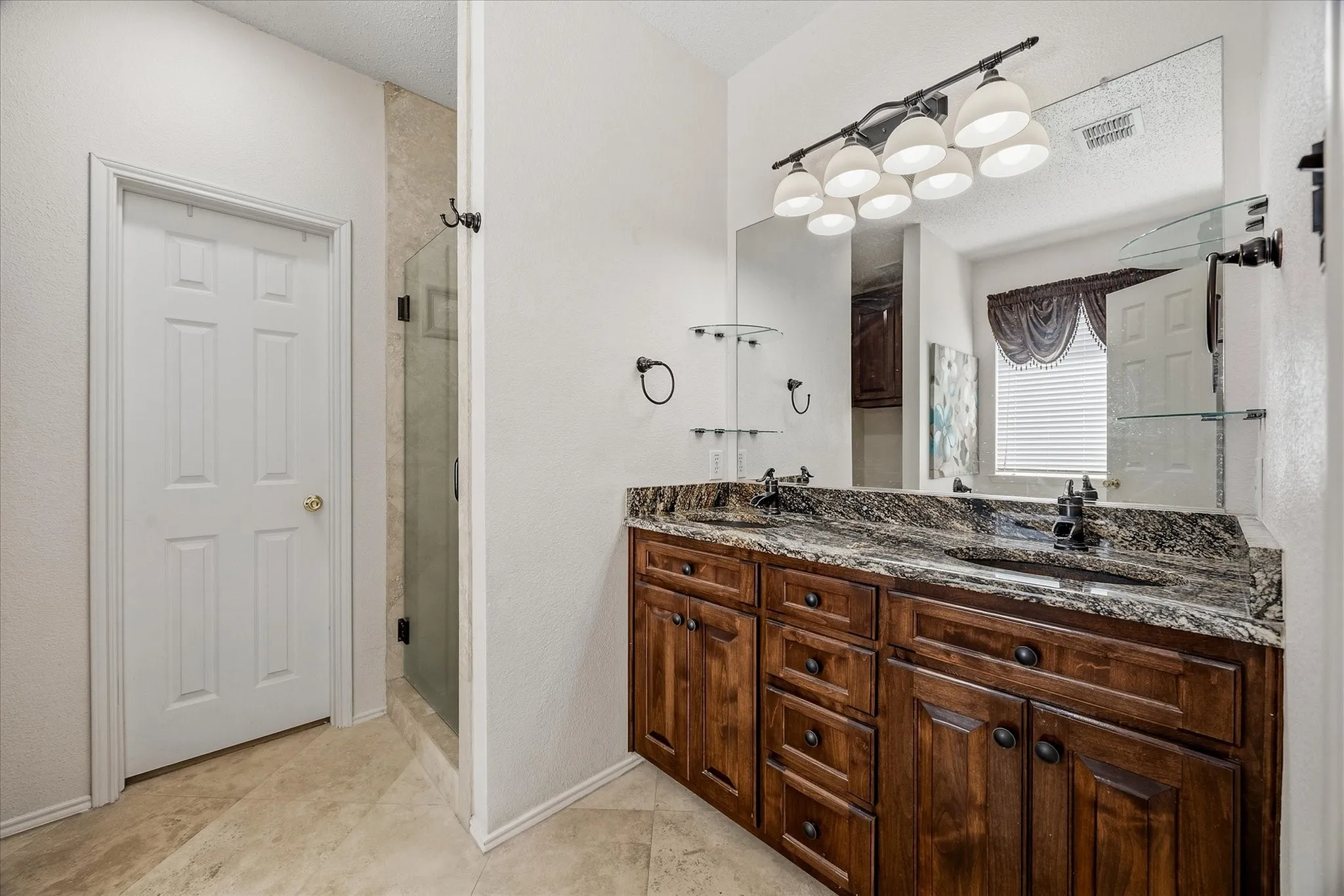 His and her vanities provide ample storage space