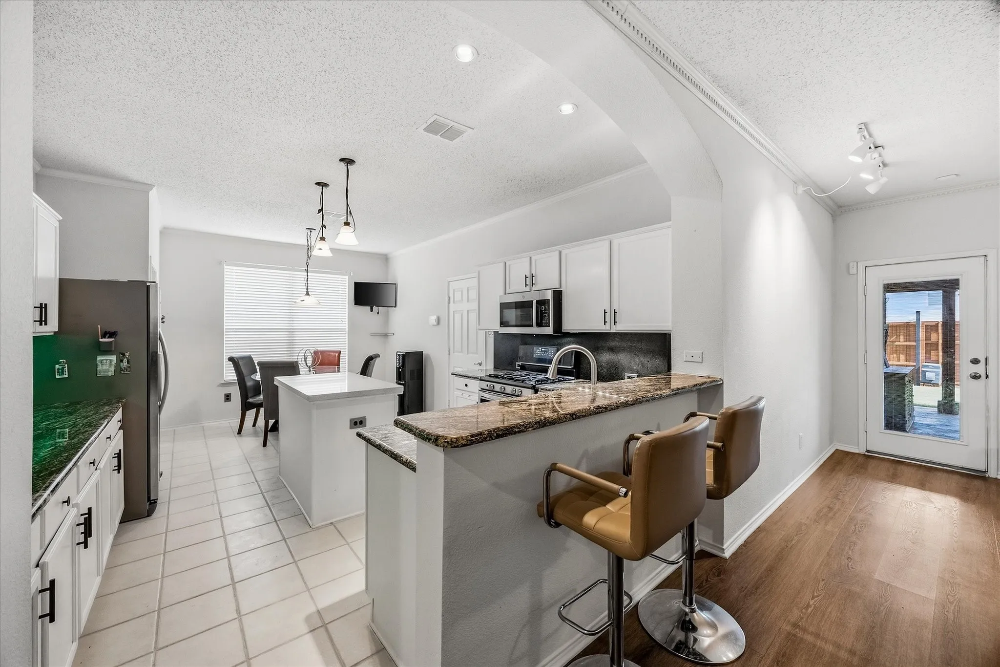 Kitchen opens onto breakfast area
