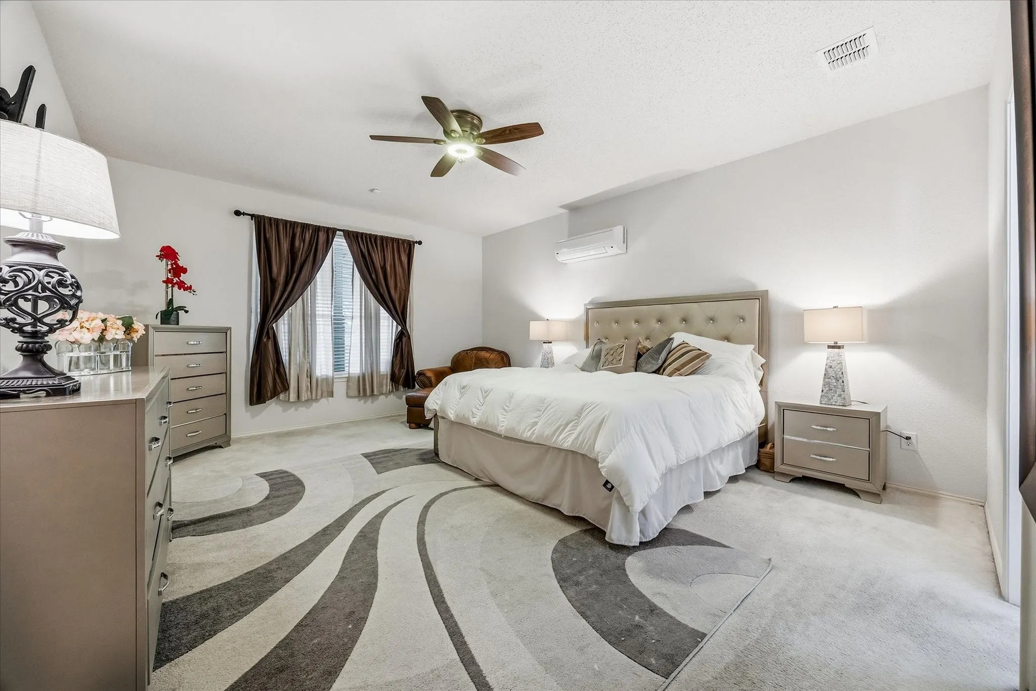 This stunning master bedroom can easily handle large furniture