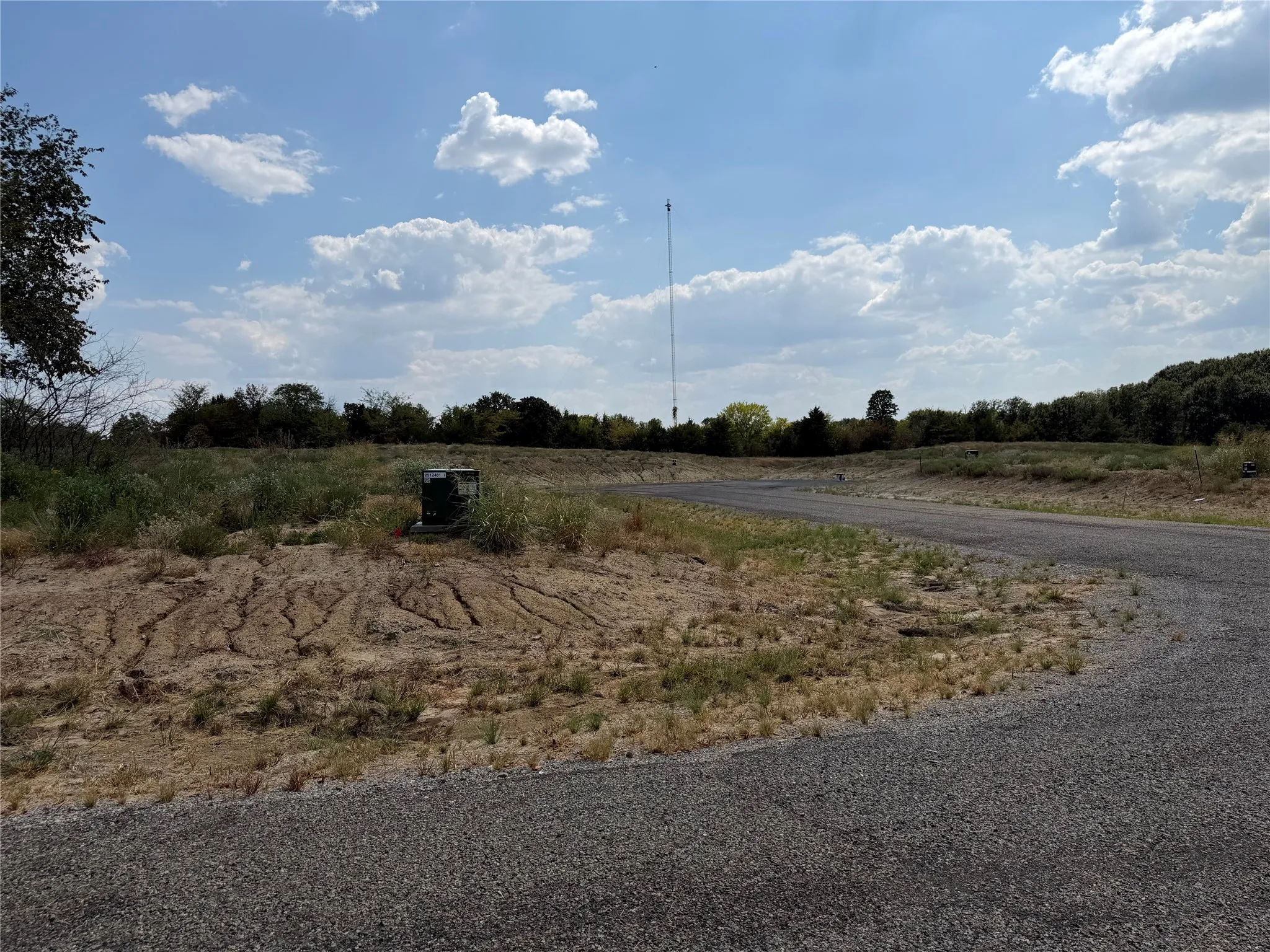 Gravel surface pathway with surrounding undeveloped land